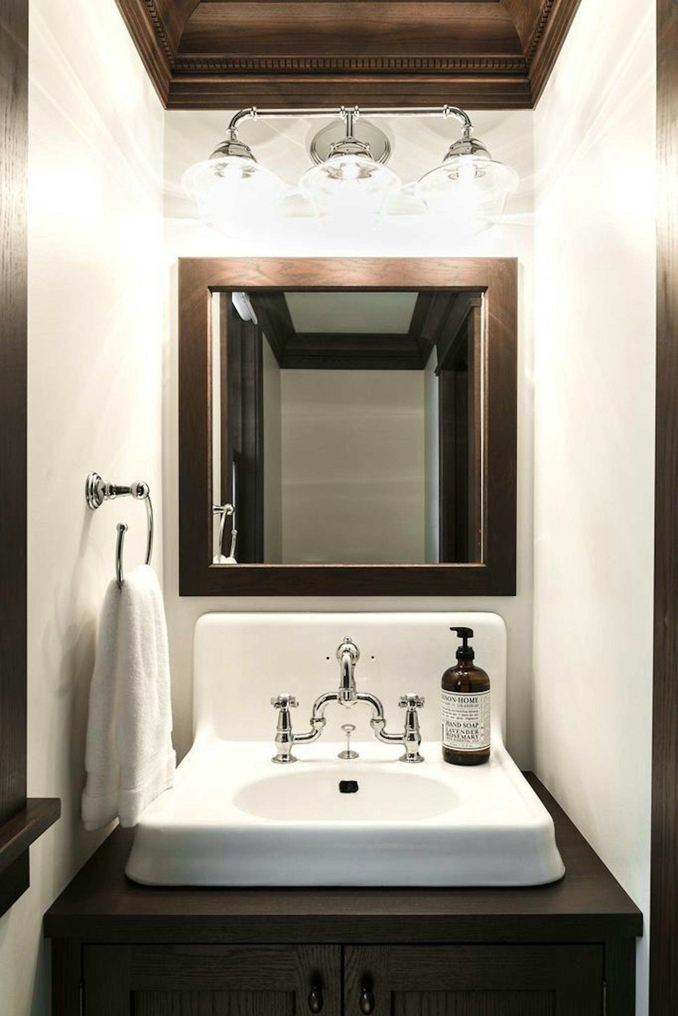 A new powder room includes a salvaged vintage sink.