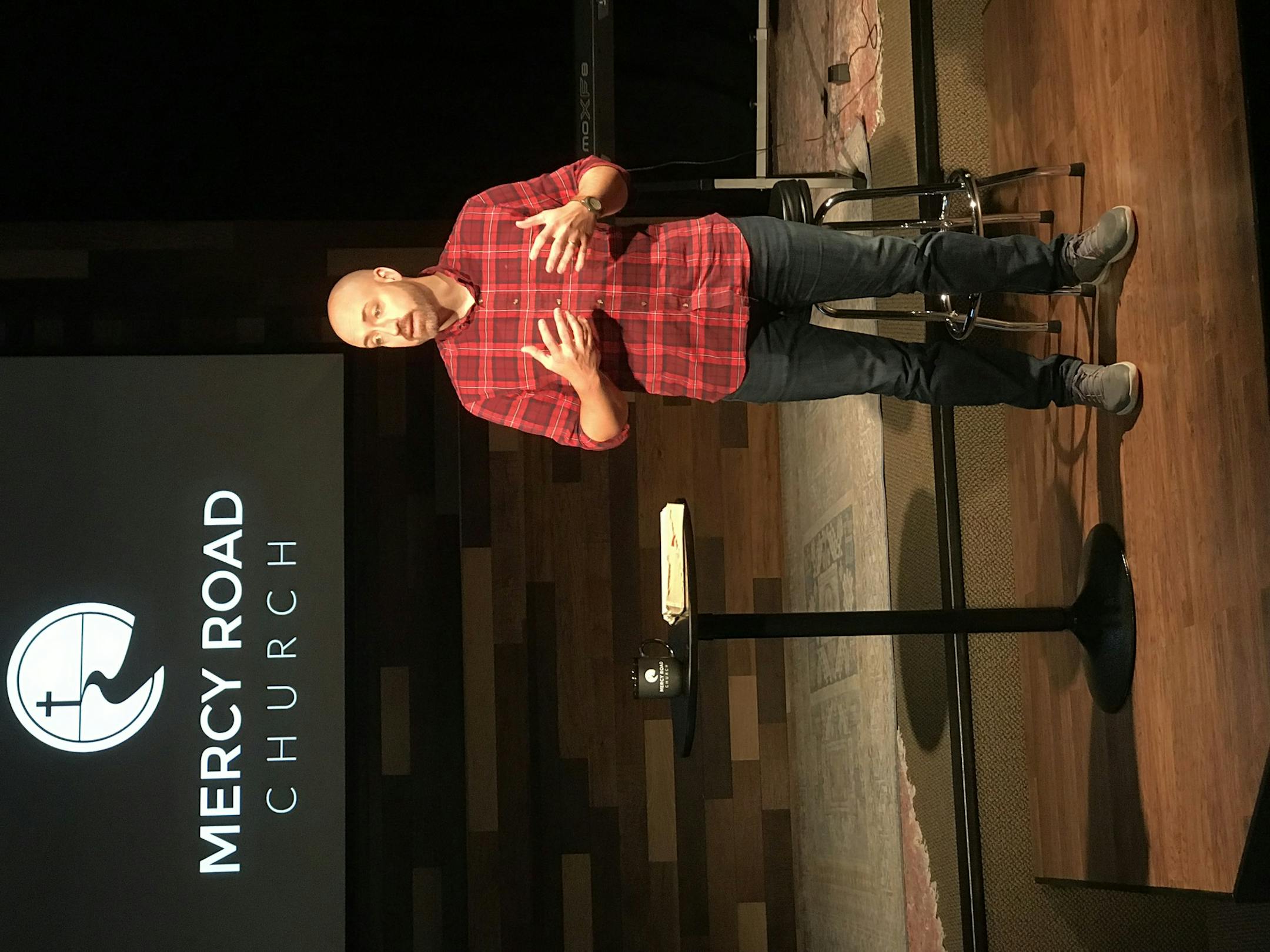 The Rev. Mike Lotzer preaches at Mercy Road Church, the updated name for his Burnsville church. Photo courtesy of Mercy Road Church.