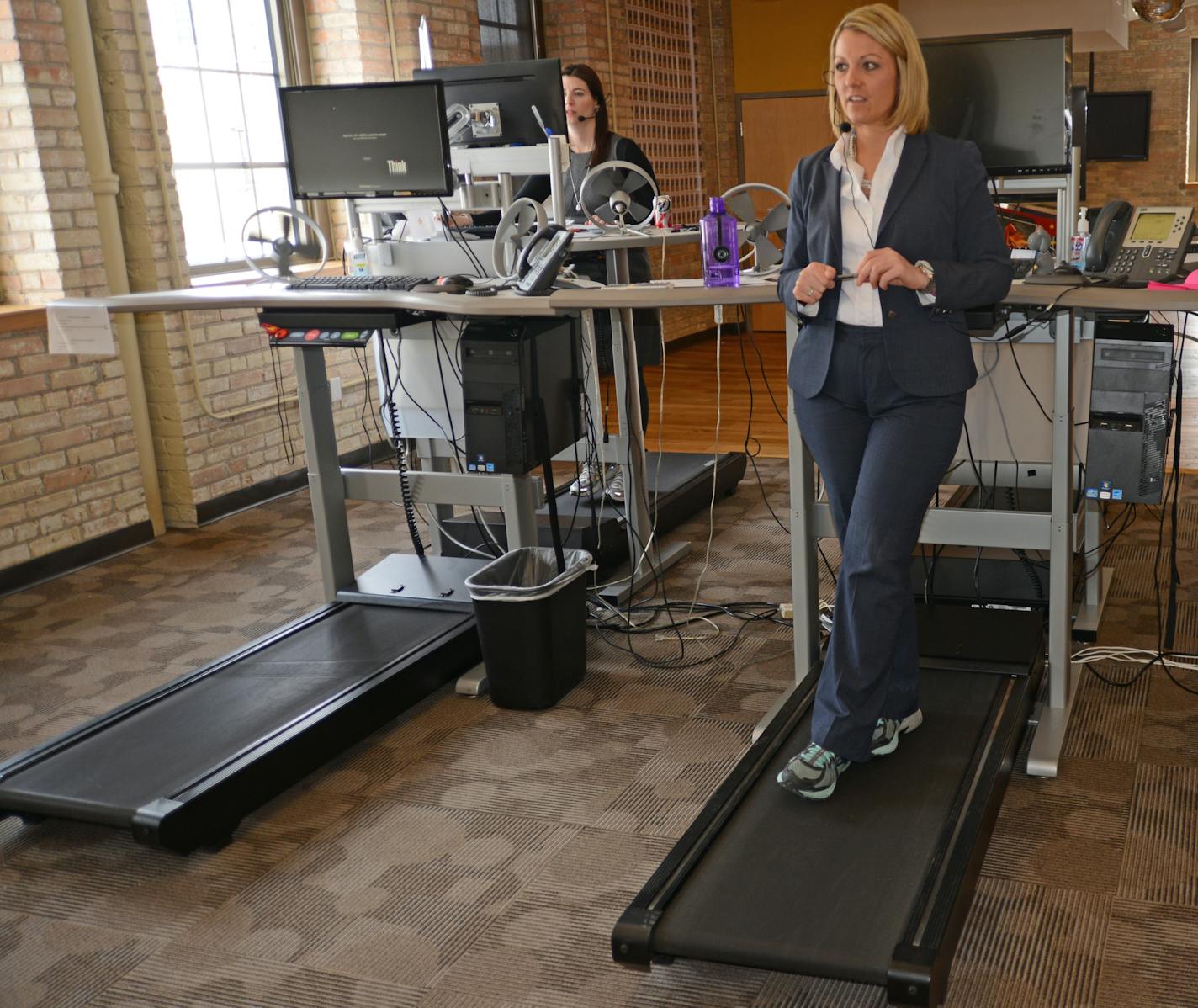 Jessica Hinz, logs from 3 to 5 miles a day on the treadmill desk station. When she need to talk on the phone sometimes she will stop the treadmill and just stand.] Salo, a financial staffing company, has been on the leading edge of the office-movement movement. They got their first treadmill desk 2007 and participated in the Mayo study. Now they have 11 of them, as well as a number of standing desks Richard.Sennott@startribune.com Richard Sennott/Star Tribune Minneapolis, Minn Monday 3/03/2014)