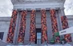 Ai Weiwei's "Safe Passage" uses life jackets abandoned by Syrian Civil War refugees to wrap the pillars utside the Minneapolis Institute of Art.
(Phot