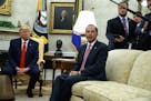 President Donald Trump listens as Secretary of Health and Human Services Alex Azar talks about a plan to ban most flavored e-cigarettes, in the Oval O