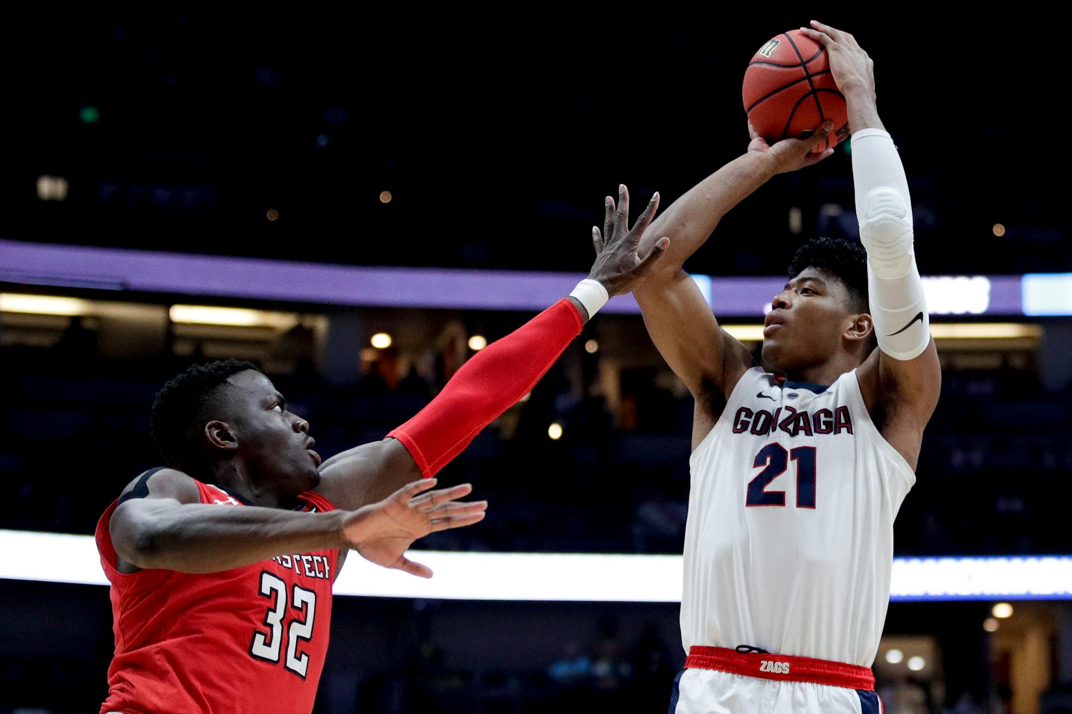 Gonzaga forward Rui Hachimura, right, shoots over Texas Tech center Norense Odiase during the first half of the West Regional final in the NCAA men's college basketball tournament Saturday, March 30, 2019, in Anaheim, Calif. (AP Photo/Jae C. Hong)