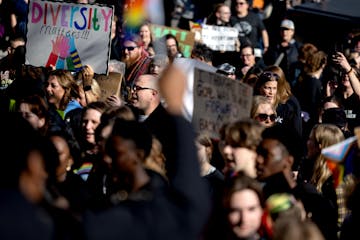 Protesters make their way to an Anoka-Hennepin school board meeting during a Youth for Unity rally on Monday, April 22.