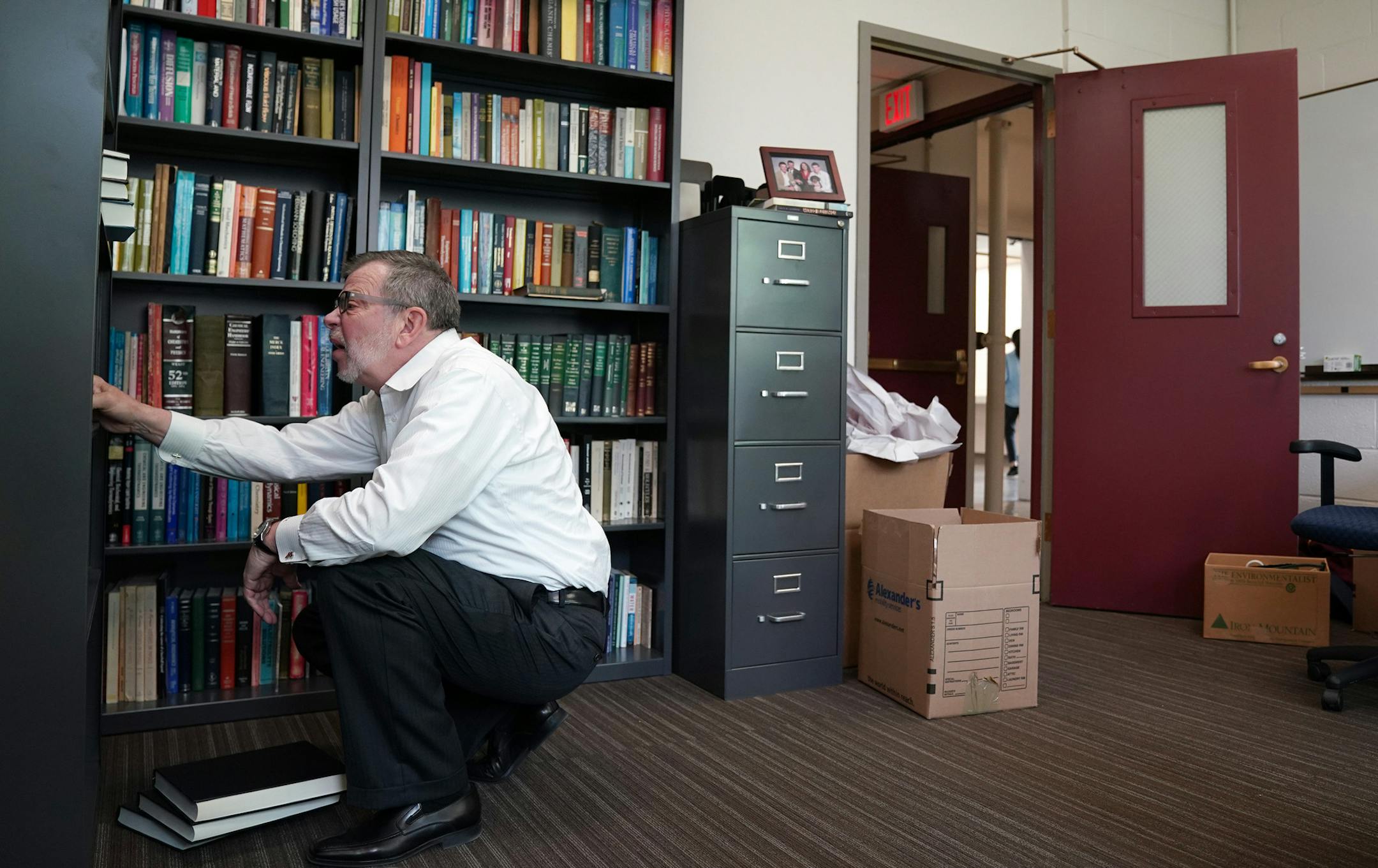 Outgoing president Eric Kaler organized his bookshelf as he unpacked boxes in his new office at Amundson Hall. ] ANTHONY SOUFFLE &#x2022; anthony.souffle@startribune.com Eric Kaler, the University of Minnesota's outgoing president, unpacked boxes in his new office in Amundson Hall, where starting on Monday he will serve in his new role fundraising for the University Wednesday, June 26, 2019 in Minneapolis.