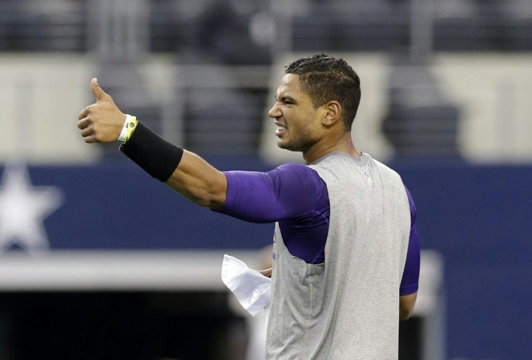 Minnesota Vikings' Josh Freeman gives a thumbs up during warm ups before an NFL football game against the Dallas Cowboys, Sunday, Nov. 3, 2013, in Arlington, Texas.