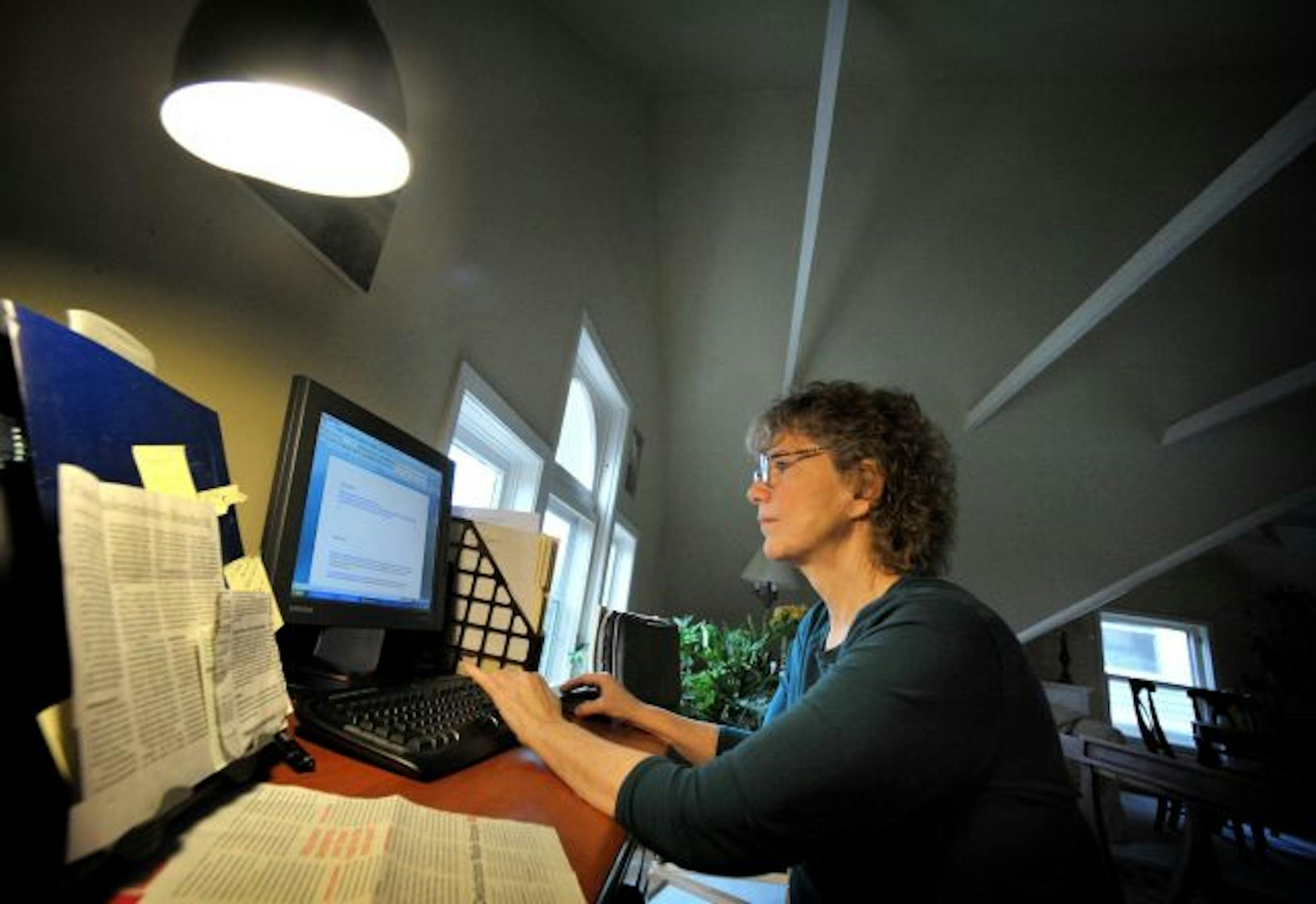 Peggy Byrne started minnesotaunemployed.com to help laid-off workers like her find the resources they need in one place. She works on the website from her home. "It's tough enough being unem­ployed without having people scrounge for the information they need," she said.