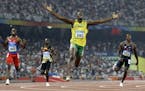 FILE - In this Aug. 20, 2008 file photo, Jamaica's Usain Bolt crosses the finish line to win the gold in the men's 200-meter final during the athletic