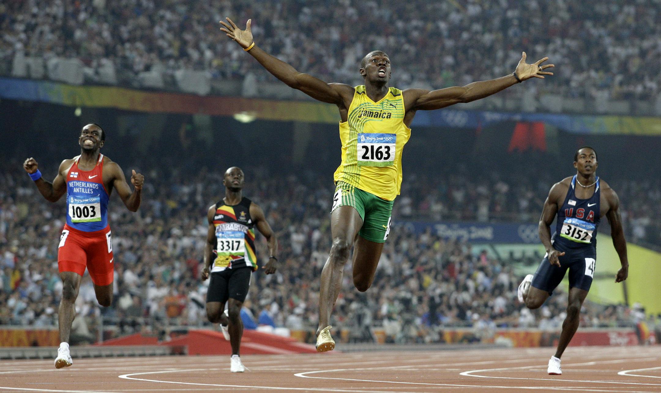 FILE - In this Aug. 20, 2008 file photo, Jamaica's Usain Bolt crosses the finish line to win the gold in the men's 200-meter final during the athletics competitions in the National Stadium at the Beijing 2008 Olympics in Beijing. How does Bolt's mother help the world's fastest man keep his cool? "We say things that will make him laugh," said Jennifer Bolt as her sprinter star offspring faces down what just may be his last Olympics. (AP Photo/Anja Niedringhaus, File)