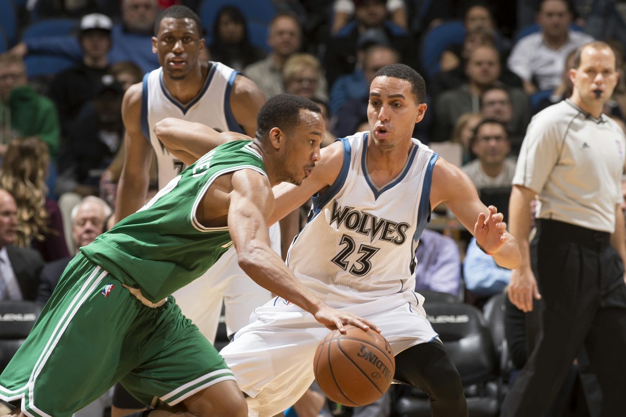 Boston Celtics guard Avery Bradley (0) tries to move the ball around Minnesota Timberwolves guard Kevin Martin (23) during the fourth quarter.