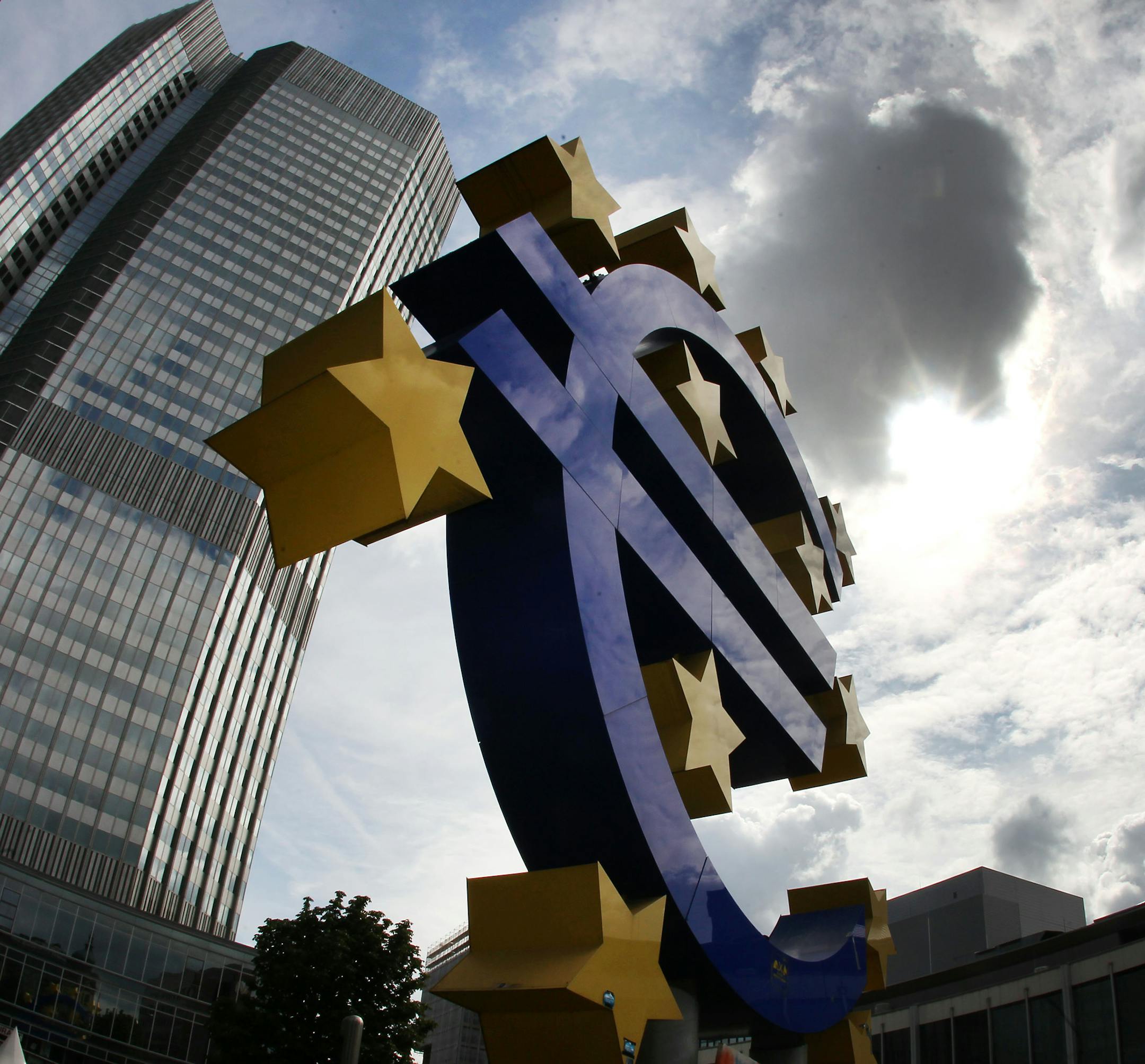 FILE - In this July 31, 2012 file photo the euro sculpture stands in front of the headquarters of the European Central Bank, ECB, in Frankfurt, Germany. Official figures are expected to confirm that Europe’s recovery from recession gathered pace in the first three months of the year. But the recovery is filled with worries, so much so that the European Central Bank is poised to deliver stimulus measures that are more usual for economies mired in recession rather than those on the upswing.