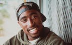FILE - In this 1993 file photo originally released by Columbia Pictures, rap musician Tupac Shakur shown in character in a scene from "Poetic Justice.