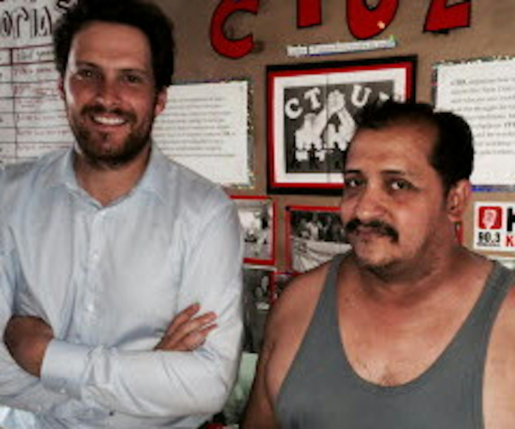 Attorney Adam Hansen, left, and plaintiff Abraham Quevedo Orantes, a former management employee who charges that Capital Building Services Group of Illinois underpaid workers who cleaned stores in Minnesota.