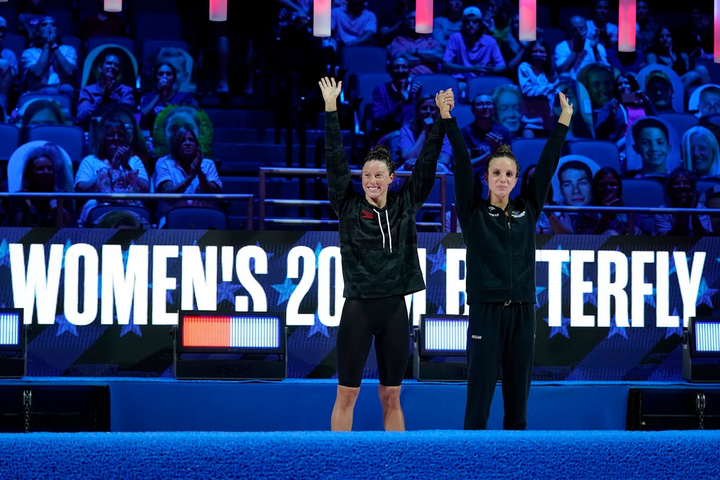 Hali Flickinger and Regan Smith celebrate at the medal ceremony of the women's 200 butterfly at the U.S. Olympic Swim Trials on Thursday