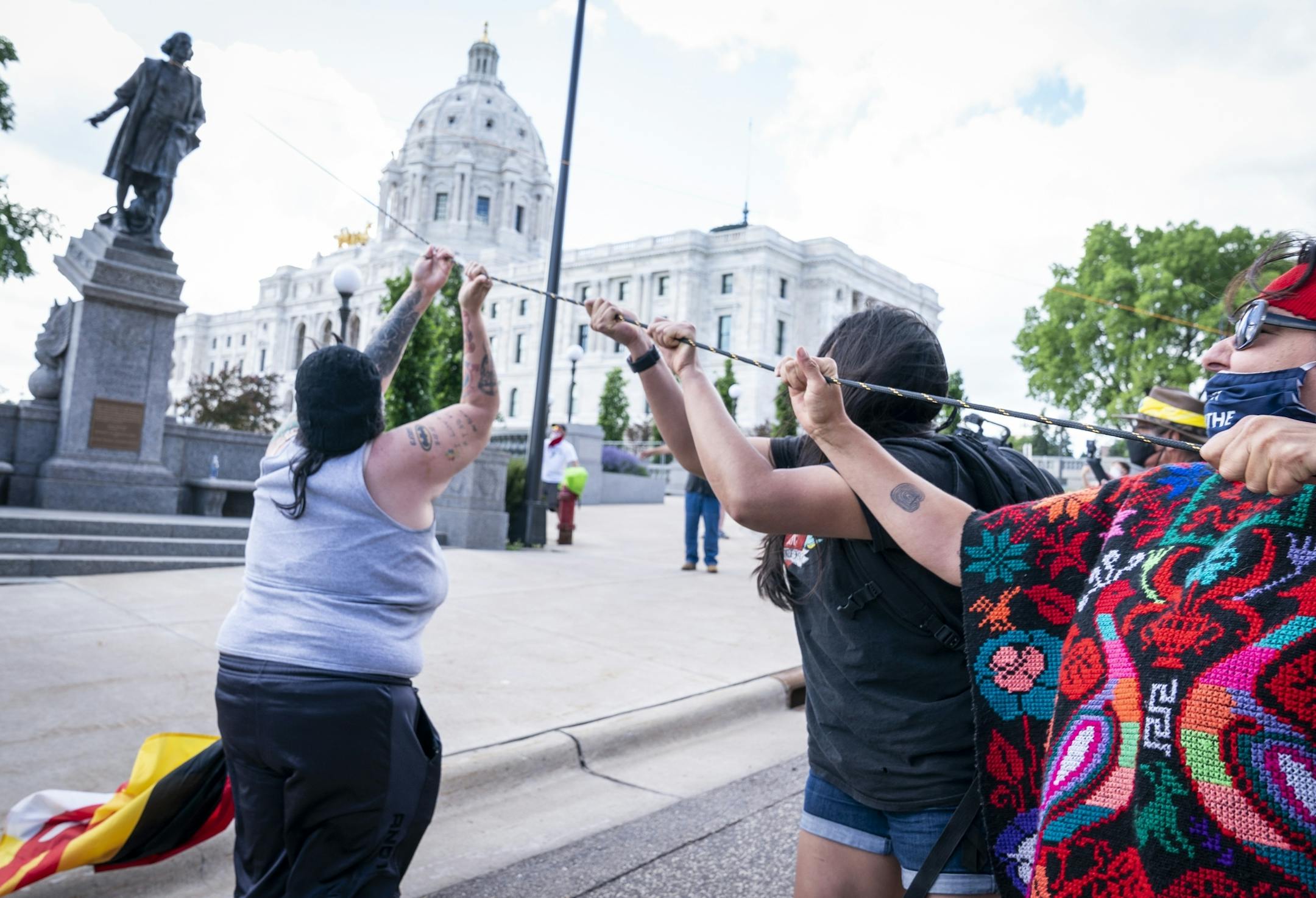Activists pulled down the statue of Christopher Columbus in front of the Minnesota State Capitol.