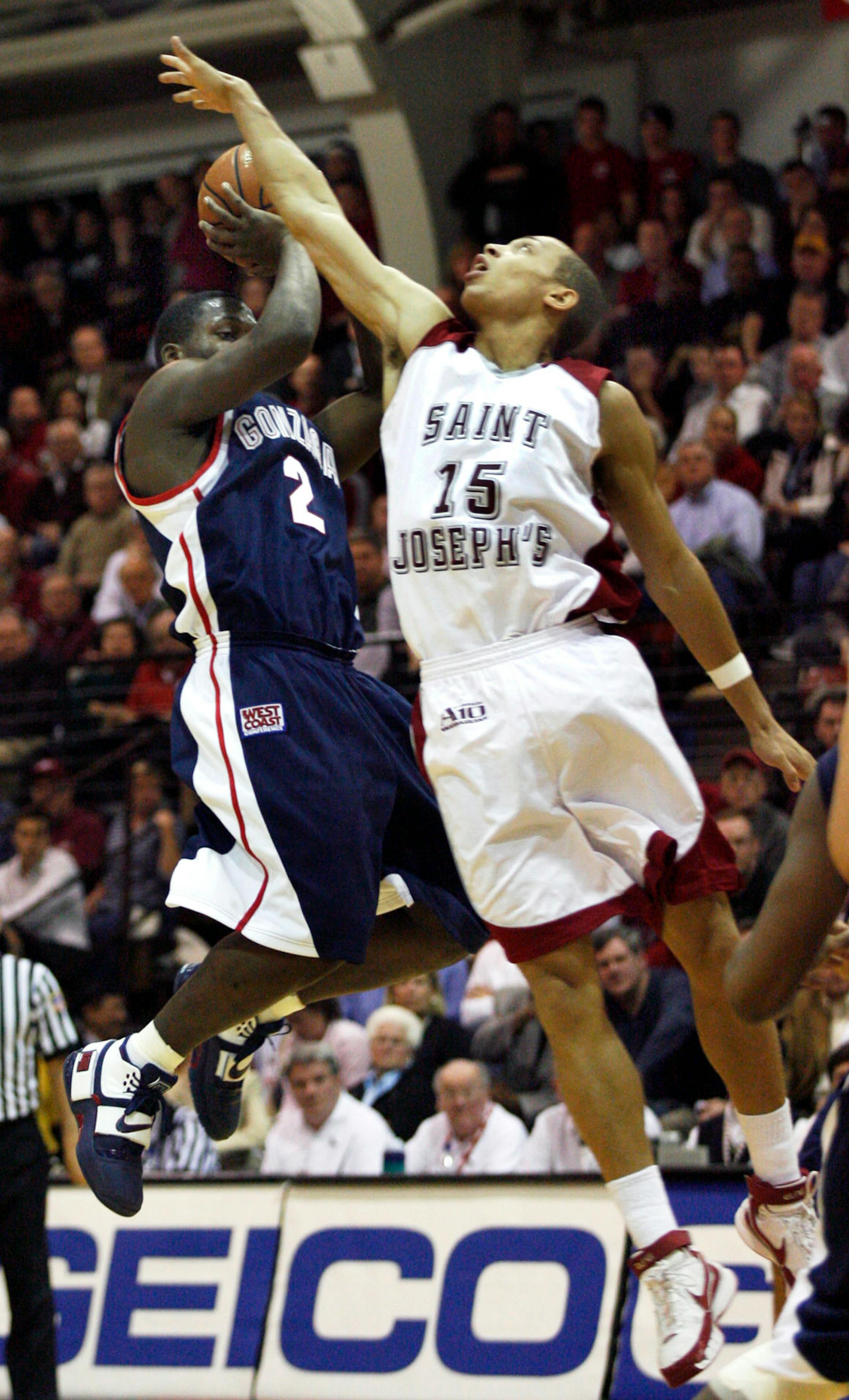 Gonzaga's Jeremy Pargo, left, goes up for a shot as St. Joseph's Garrett Wiliamson defends in the first half of a basketball game,Thursday, Nov. 29, 2007, in Philadelphia. (AP Photo/H. Rumph Jr)