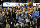 The Lynx pose with the trophy for pictures as they celebrated their WNBA finals win against the L.A. Sparks at Williams Arena on Wednesday, October 4,