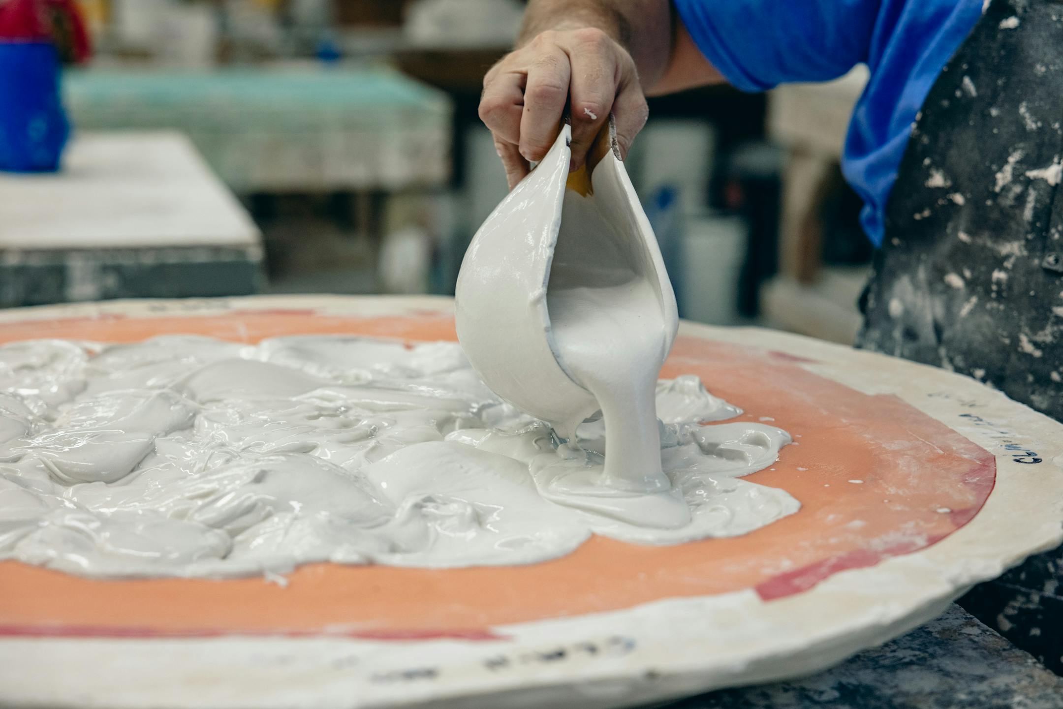 Adam Bergeron pours a mold at Inspired Ornamental, his plaster fabrication company in Salem, N.H., on Aug. 18, 2023. Designers and fabricators are finding new forms for the ornamental material. (Jesse Burke/The New York Times)