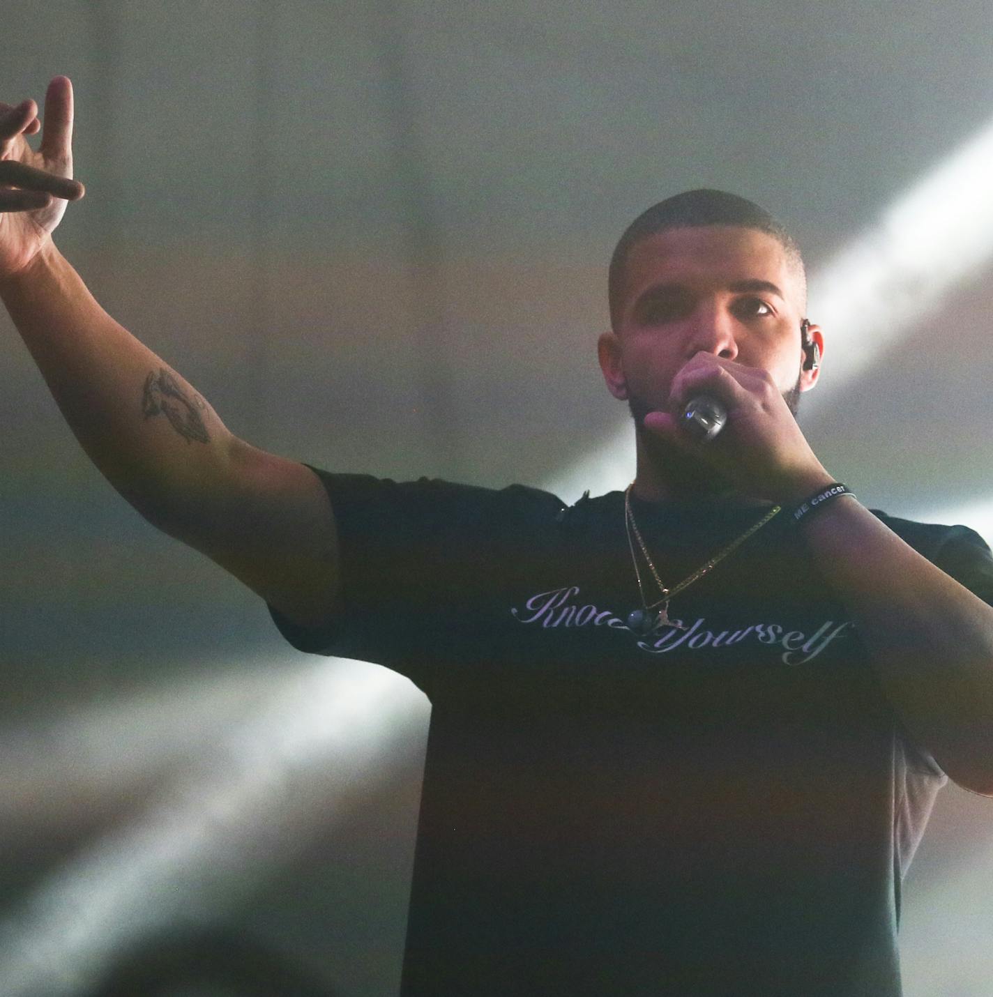 FILE - In this March 19, 2016 file photo, Drake performs during the South by Southwest Music Festival in Austin, Texas. Drake released two new songs to iTunes,Tuesday, April 5, including one that features both Jay Z and Kanye West called "Pop Style." (Photo by Jack Plunkett/Invision/AP, File)