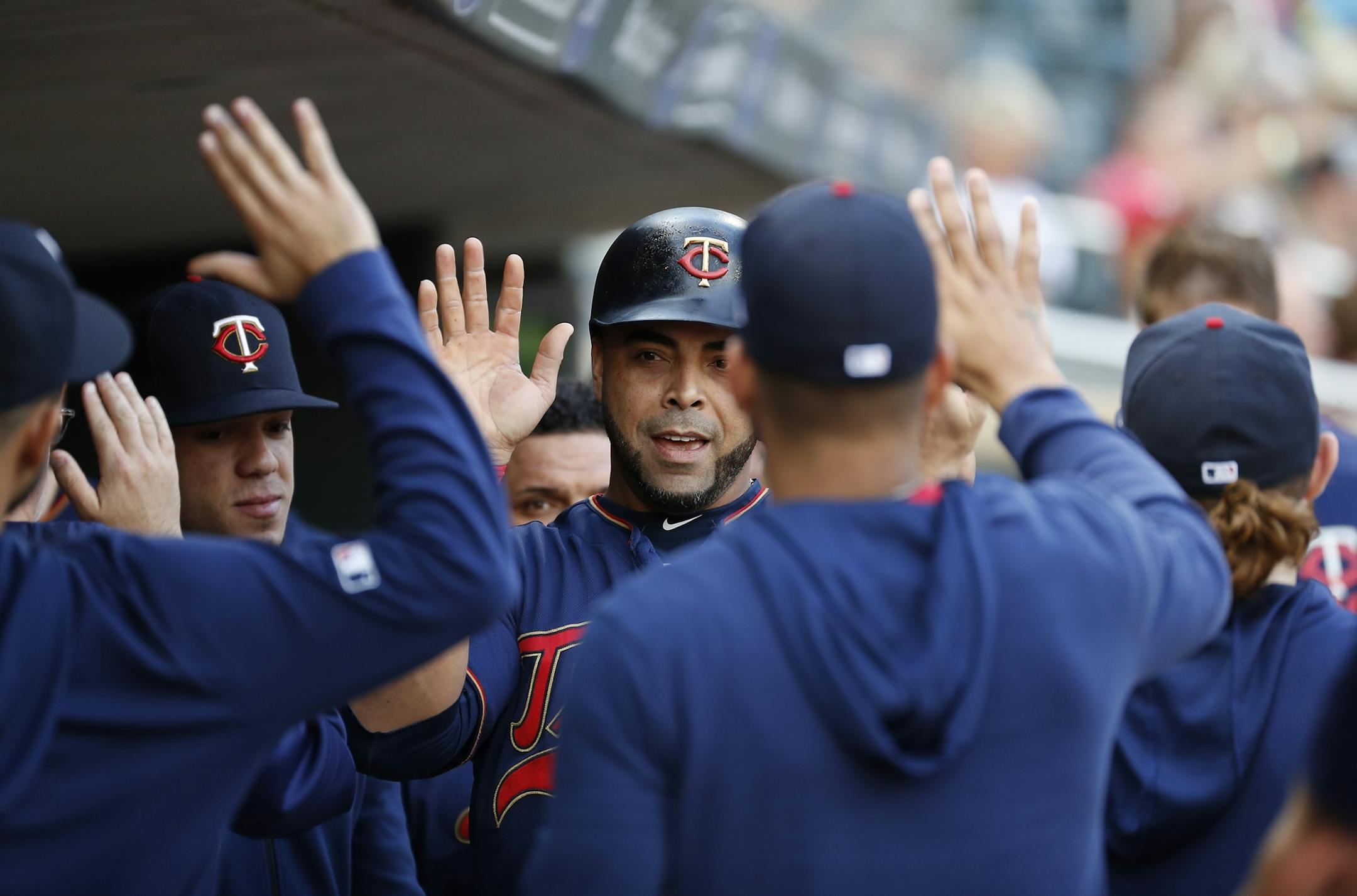 Minnesota Twins designated hitter Nelson Cruz (23) celebrates scoring in the first inning.