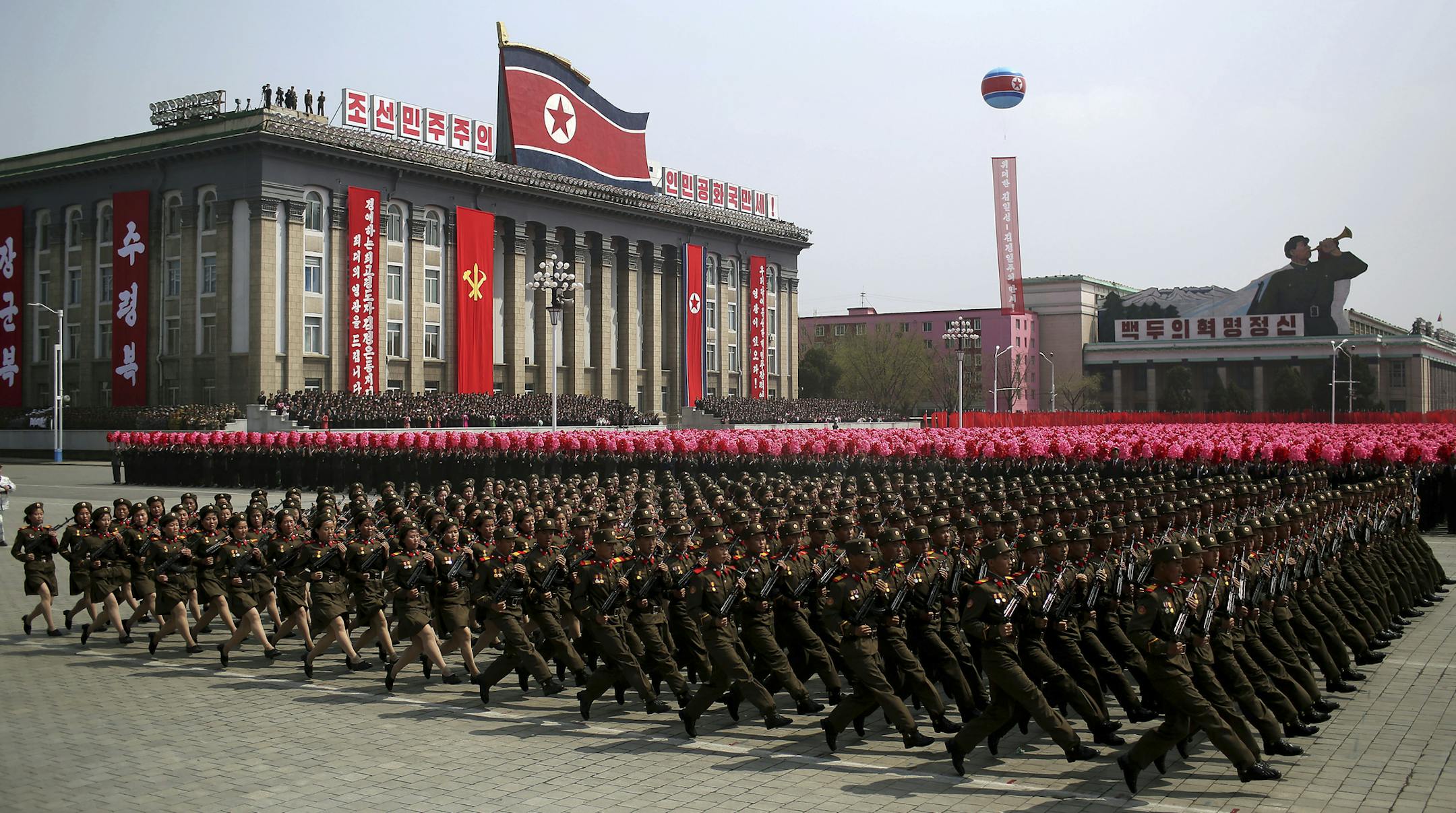 FILE - In this April 15, 2017, file photo, soldiers march across Kim Il Sung Square during a military parade in Pyongyang, North Korea. North Korea is preparing to stage a major event to mark the 70th anniversary of the founding of its military on Feb. 8, 2018 - just one day before the opening ceremony of the Pyeongchang Winter Olympics in South Korea. (AP Photo/Wong Maye-E, File)