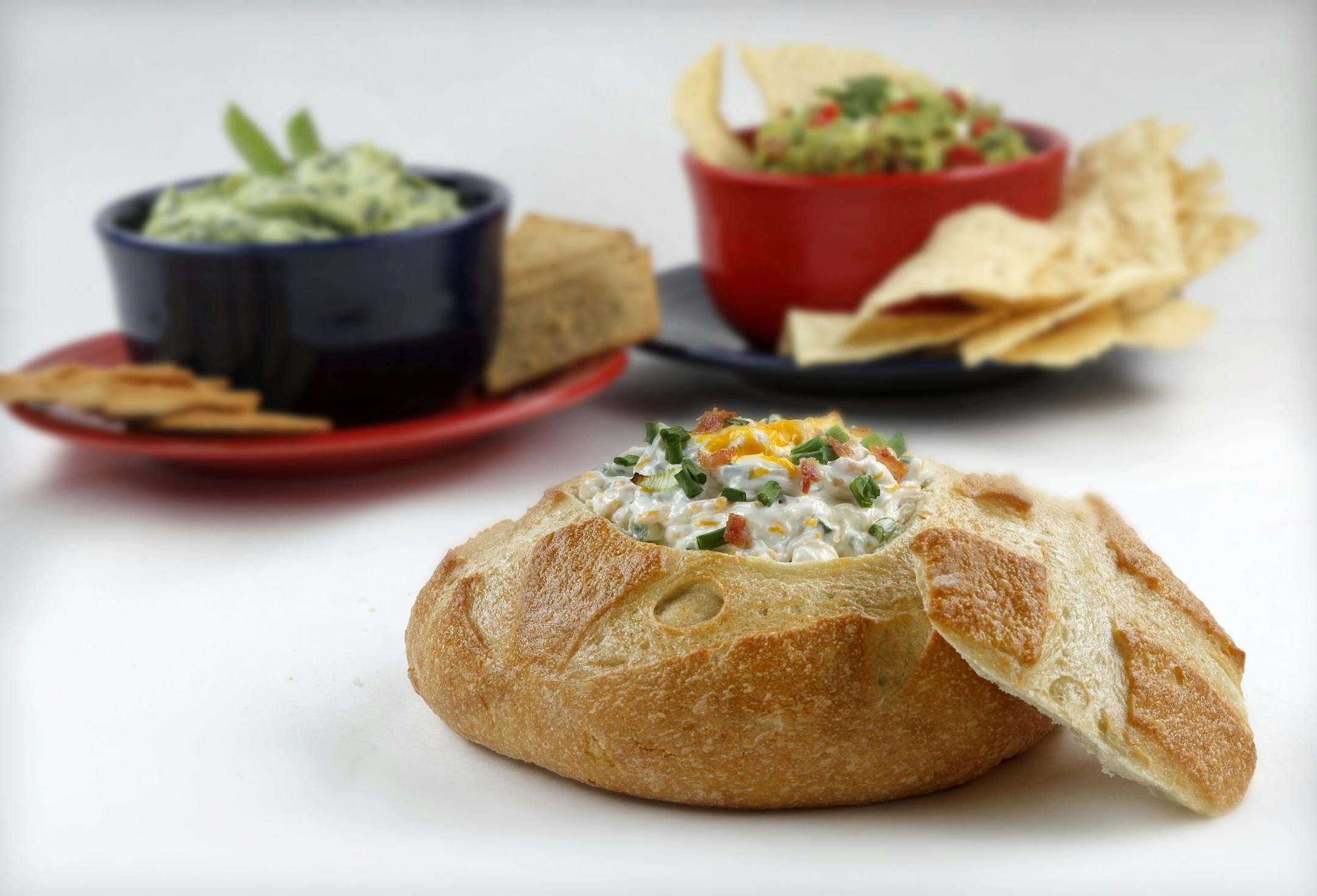 Warm and Creamy Bacon Dip can be baked in a bread bowl.