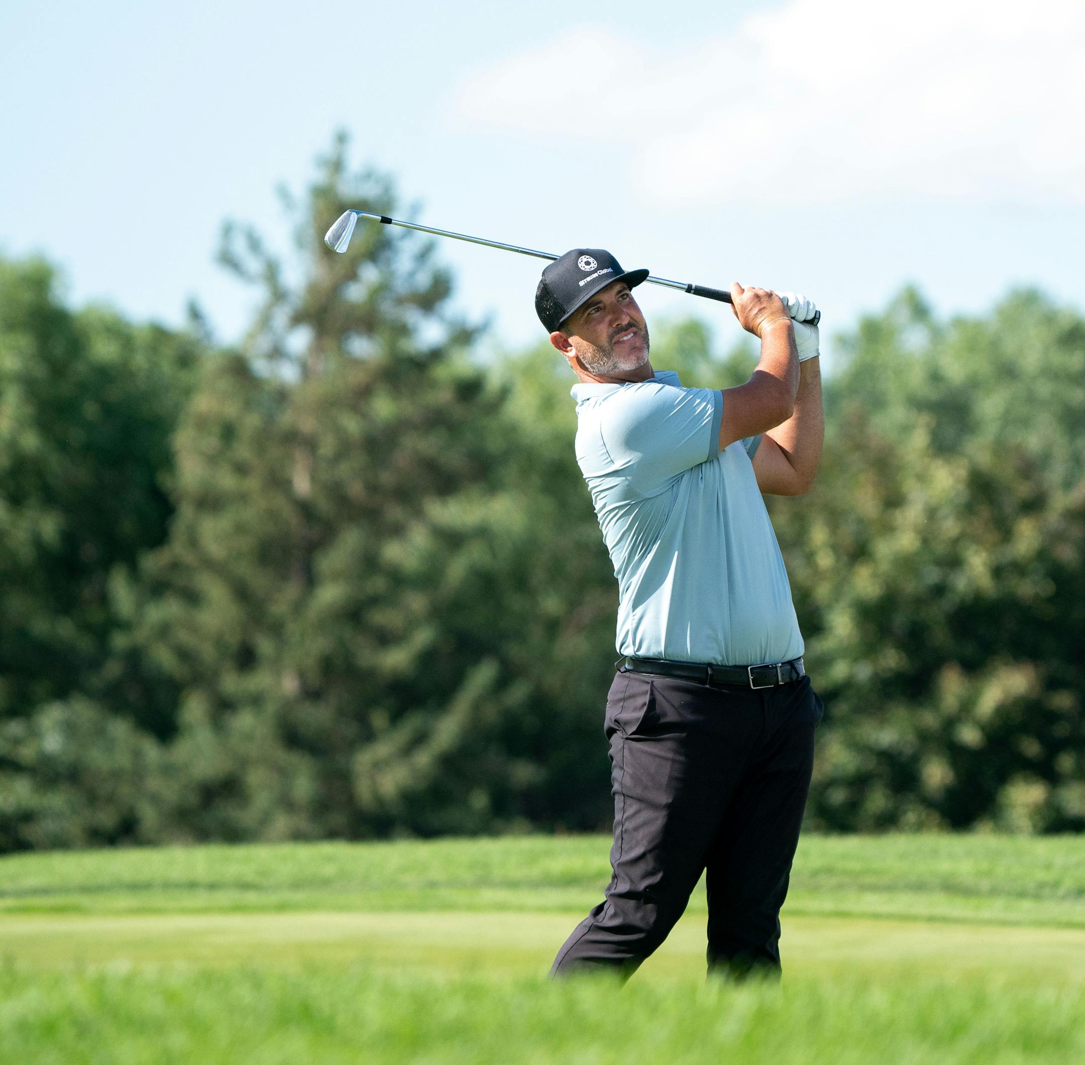 Scott Piercy takes a shot on the 9th hole during the 3M Open.