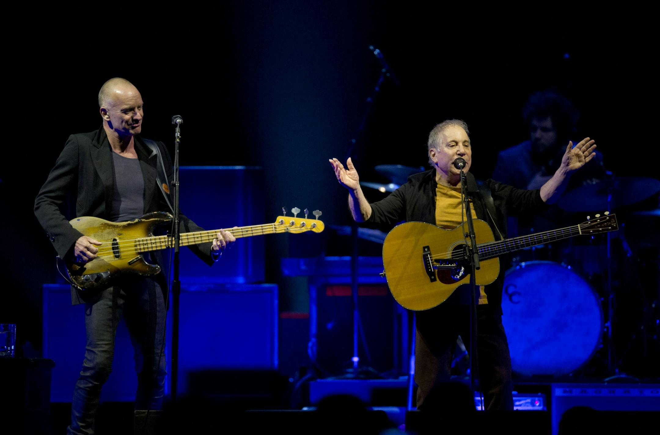 Longtime New York neighbors Sting and Paul Simon decided to hit the road and tour together. The Paul Simon & Sting: On Stage Together tour stopped at Xcel Energy Center in St. Paul Sunday night, February 23, 2014. Sting, left, and Paul Simon performing Sting's "Brand New Day" to open their set Sunday night at Xcel Energy Center.