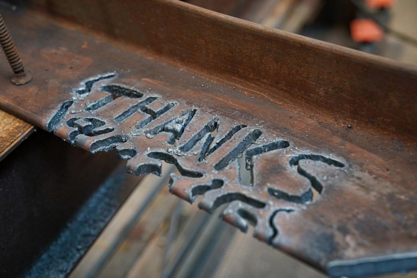 Governor Tim Walz watched Travis Sturges put the finishing touches on this steel thank you beam for him after he signed the $1.9 billion bonding bill. Earlier Josh Kalina carved the actual words Thank You.