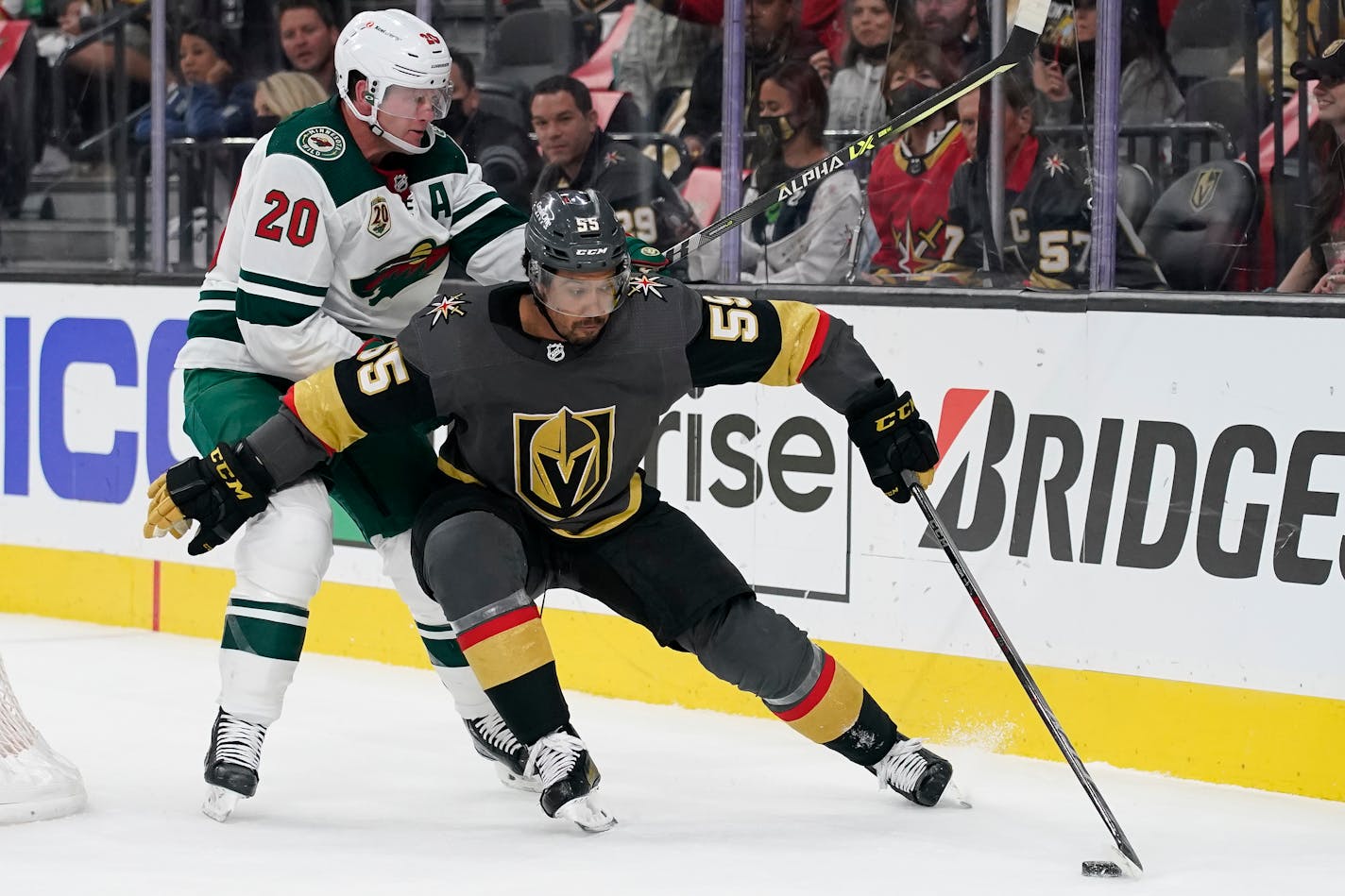 Vegas right wing Keegan Kolesar skates around Wild defenseman Ryan Suter during the second period of Game 5