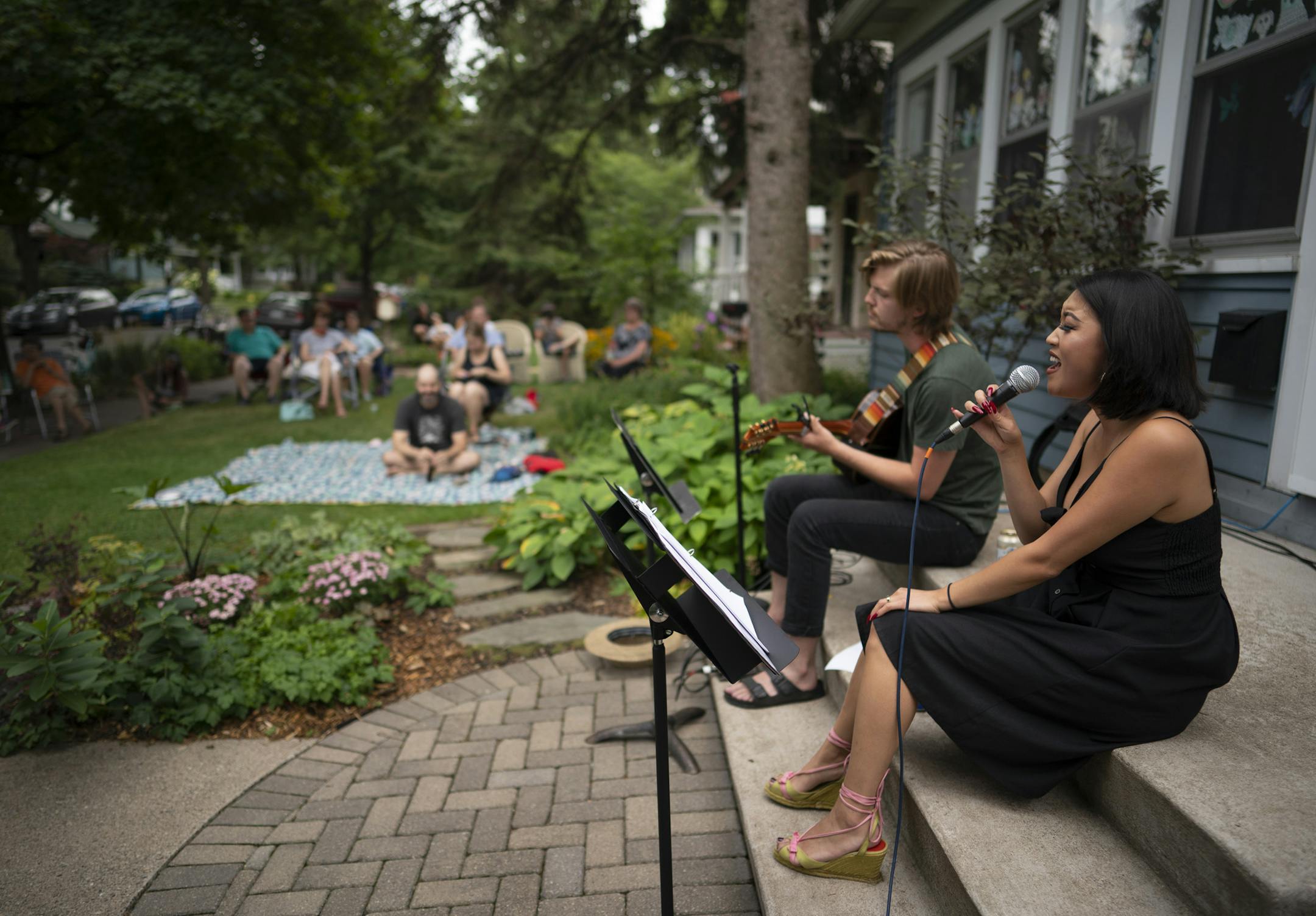 Hope Nordquist and Kai Brewster performed from the front steps of the McHenry house in August.