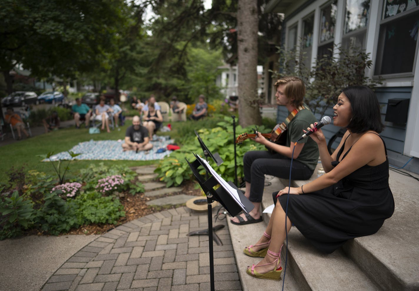 Hope Nordquist and Kai Brewster performed from the front steps of the McHenry house in August.