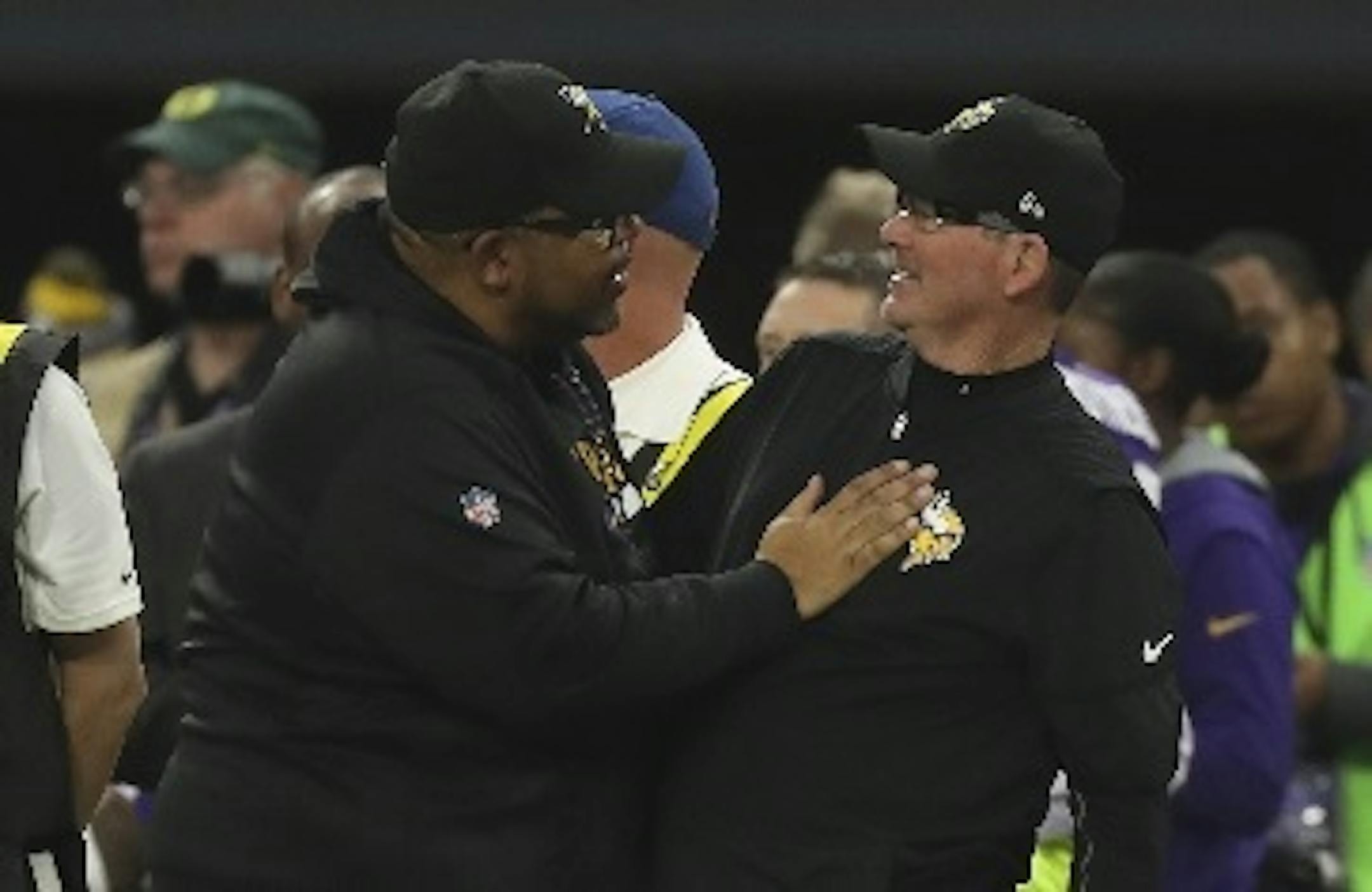 Vikings co-defensive coordinator Andre Patterson, left, is 60. Head coach Mike Zimmer, right, is 64. Zimmer and many of his top staffers would be considered to be in a high-risk age group for coronavirus. But the safety protocols at TCO Performance Center minimize any risks as they come and go to work at the team facility.