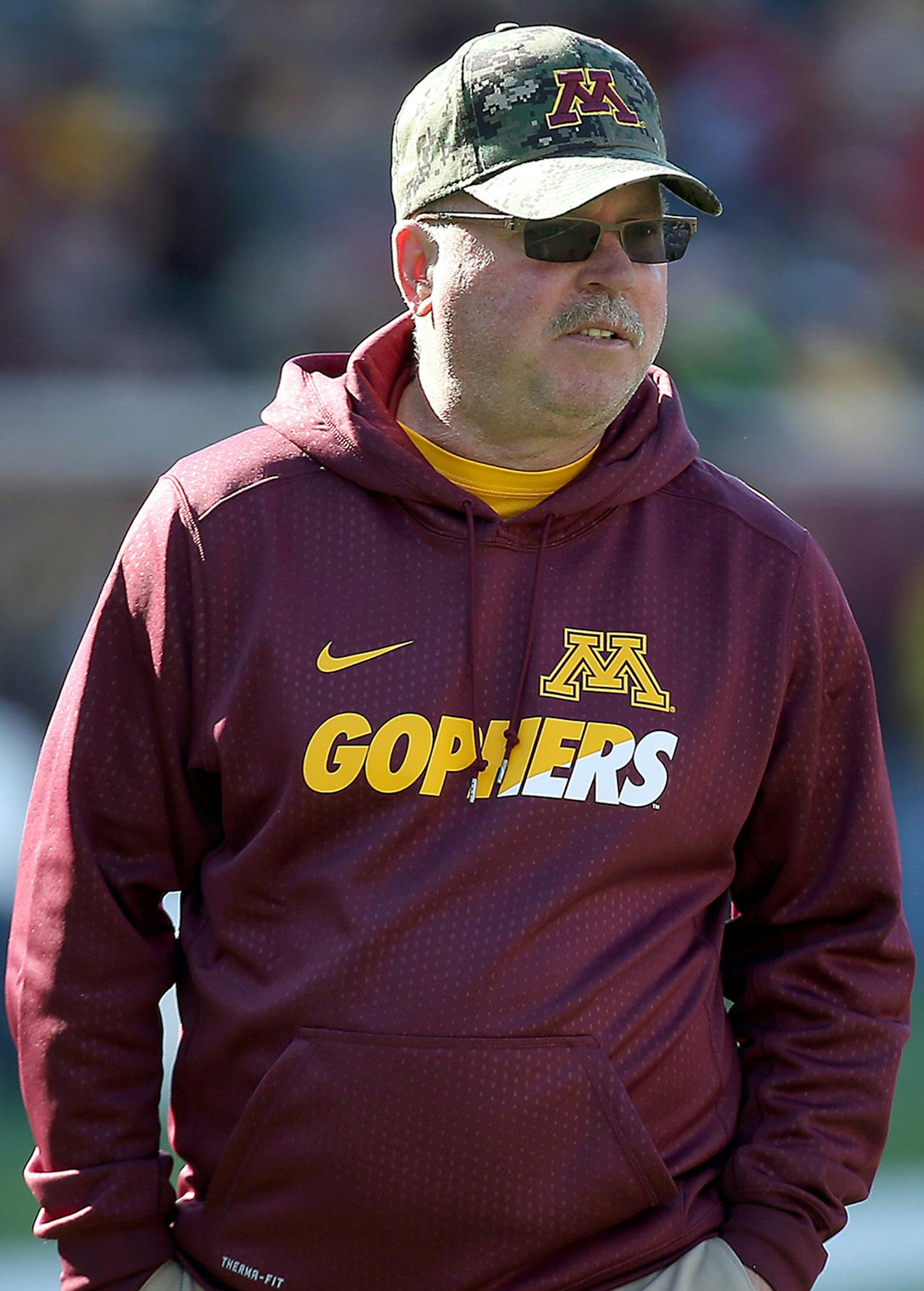 In this Oct. 17, 2015, photo, University of Minnesota NCAA college football head coach Jerry Kill walks the field before a game against Nebraska at TCF Bank Stadium in Minneapolis, Minn. Minnesota coach Jerry Kill abruptly retired because of health reasons on Wednesday, Oct. 28, 2015, ending his efforts to rebuild the Golden Gopher football program during a tenure that included a series of game-day seizures. (Elizabeth Flores/Star Tribune via AP) ORG XMIT: MIN2015102811025325