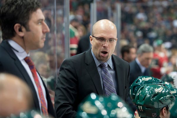 Minnesota Wild head coach Mike Yeo directs the team during a break in action during the third period against Calgary last month.