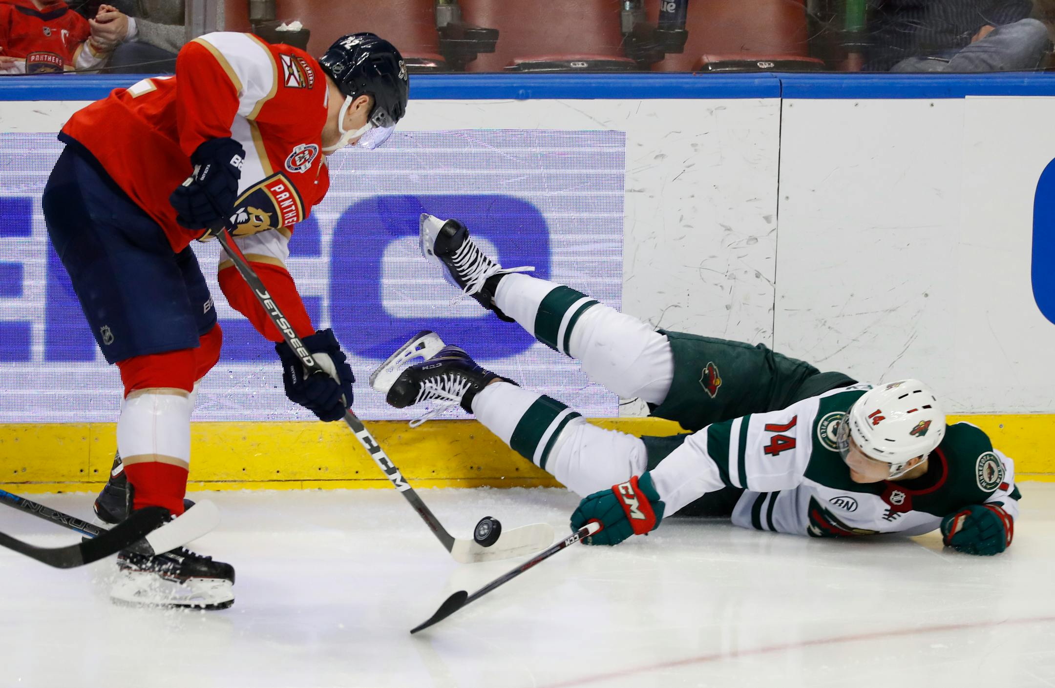 Florida Panthers center Frank Vatrano (72) and Minnesota Wild center Joel Eriksson Ek (14) battle for the puck during the third period of an NHL hockey game, Friday, March 8, 2019 in Sunrise, Fla. (AP Photo/Wilfredo Lee)