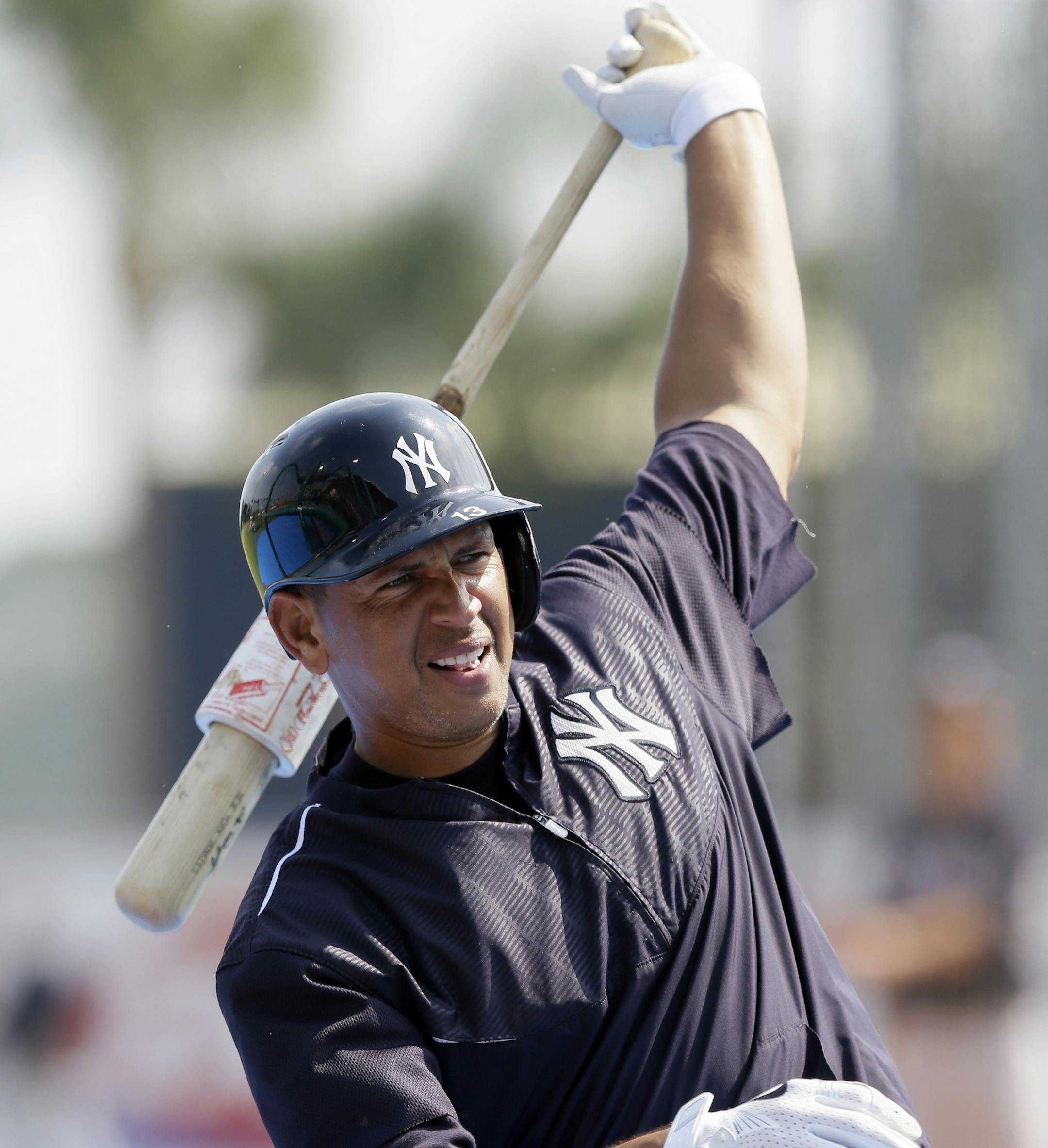 New York Yankees' Alex Rodriguez warms up before a spring training exhibition baseball game against the Detroit Tigers in Lakeland, Fla., Friday, March 20, 2015. (AP Photo/Carlos Osorio)