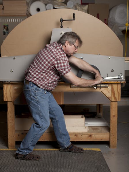Kurt Nordwall, a framing technician at the Minneapolis Institute of Arts, uses a machine he built to reproduce archaic frame designs. Photo by Dan Den