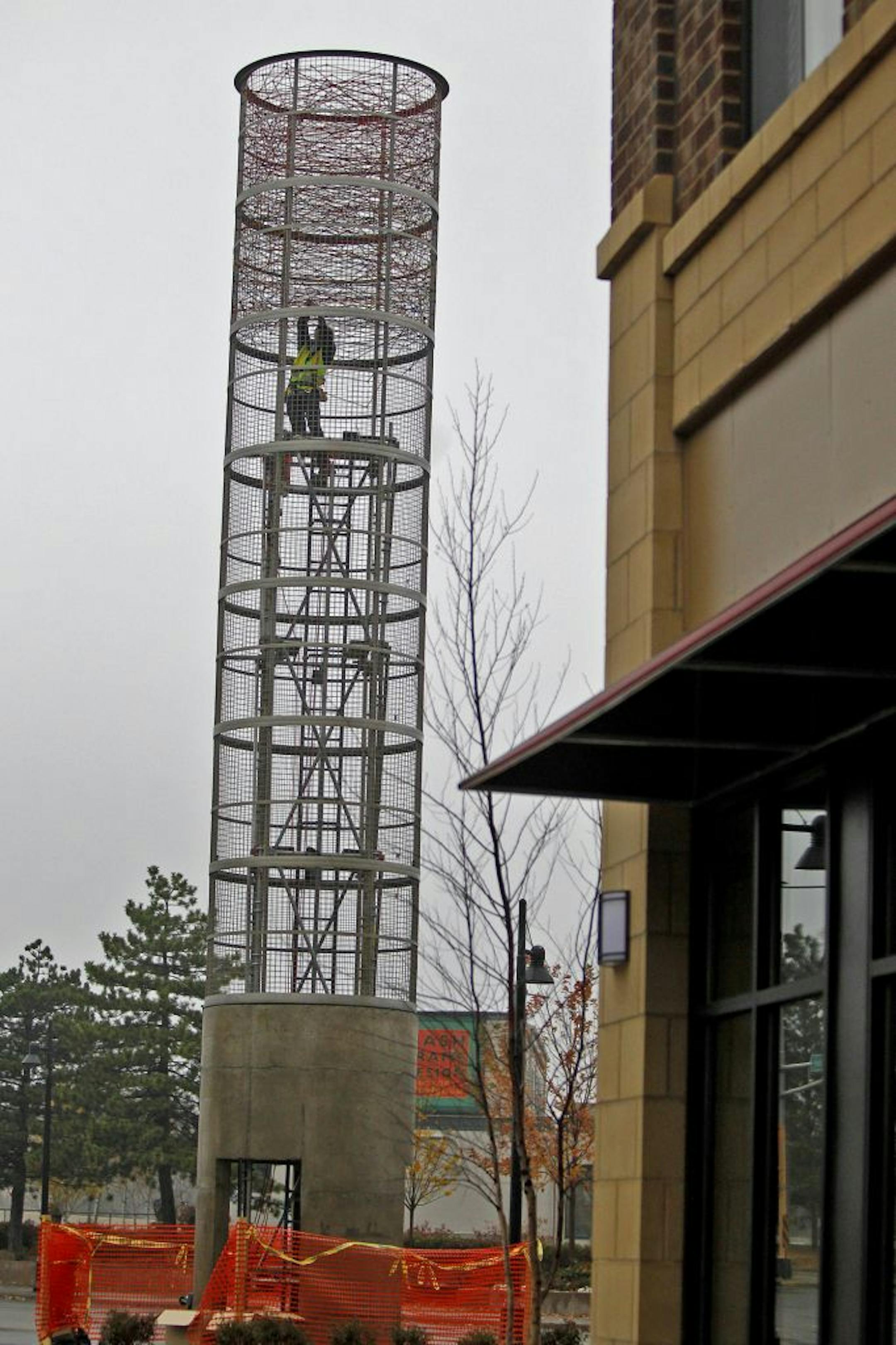 Renowed Sculptor Randy Walker worked on his latest creation, the iconic landark at the Towerlight on Wooddale Avenue known as "The Dream Elevator," Tuesday, October 23, 2012 in St. Louis Park, MN.(ELIZABETH FLORES/STAR TRIBUNE) ELIZABETH FLORES � eflores@startribune.com