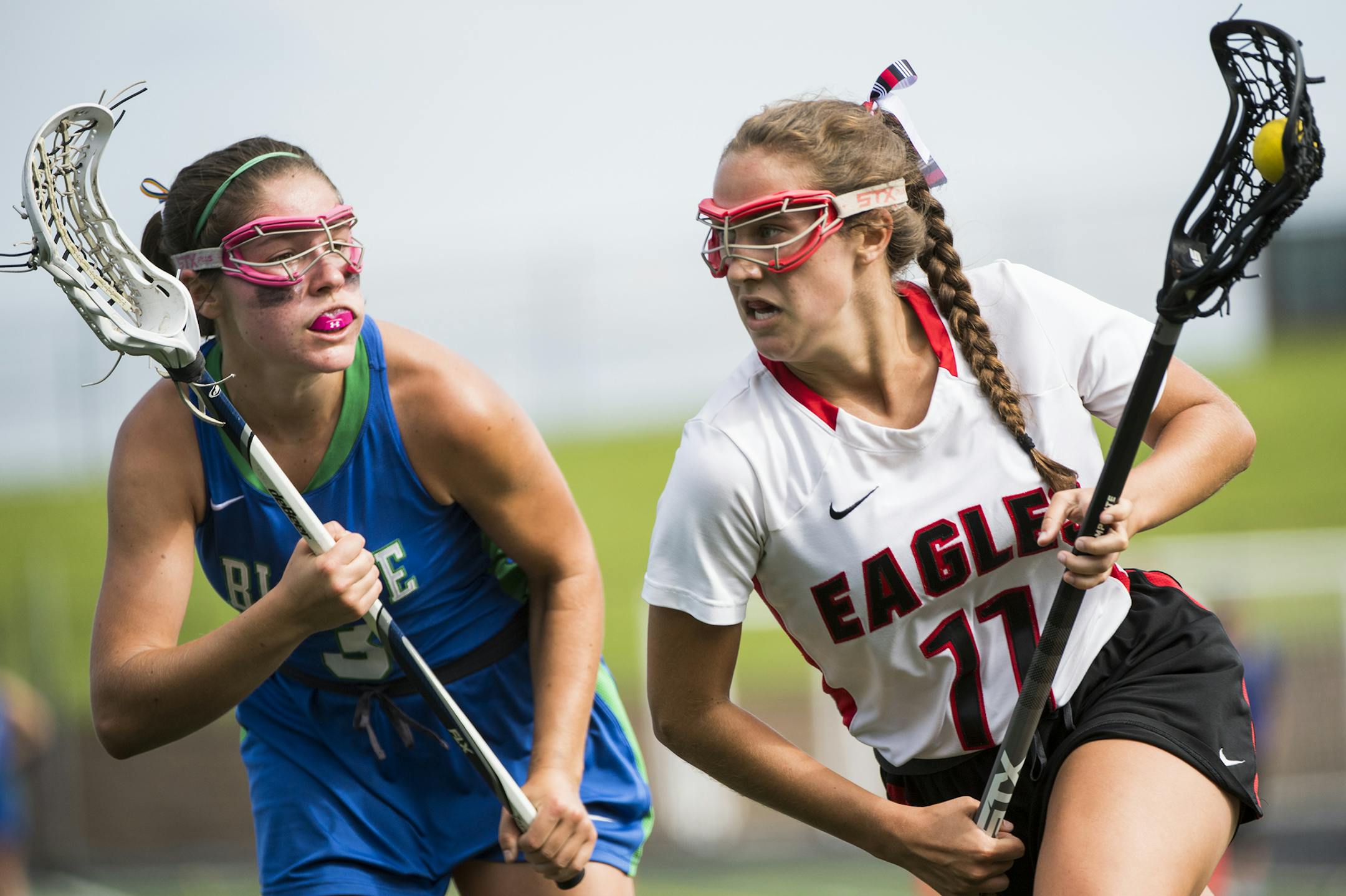 Eden Prairie midfielder Kelly Wolfe (11) drives by Blake defender Lucy Burton (3). ] Isaac Hale ï isaac.hale@startribune.com The Eden Prairie Eagles defeated the Blake Bears 11-9 in the 2016 Minnesota State High School Girls Lacrosse Tournament at Chanhassen High School on Saturday, June 18, 2016.