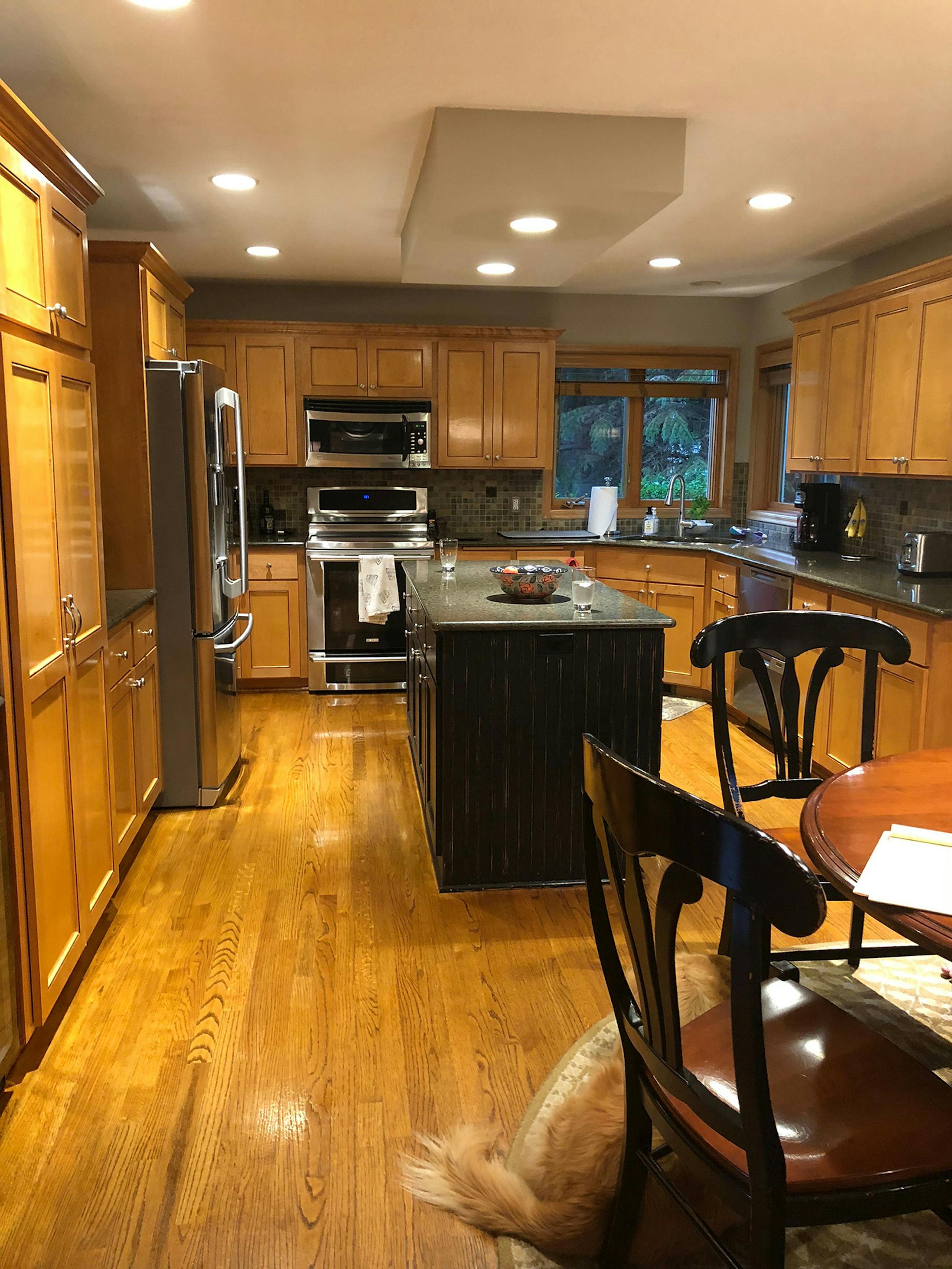 The Hatfield's kitchen had dark woodwork that they didn't like from the start.