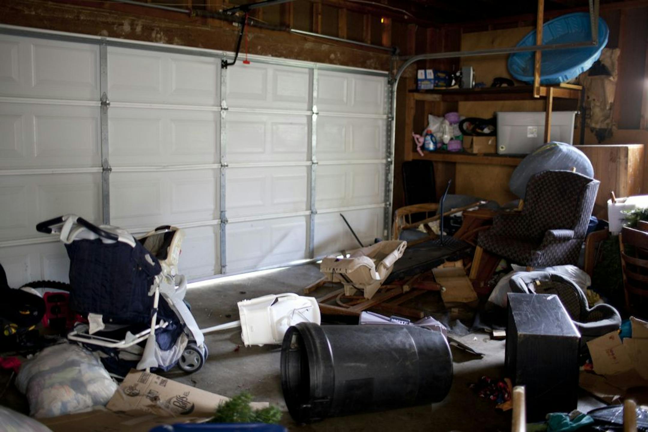Belongings strewn in the garage.
