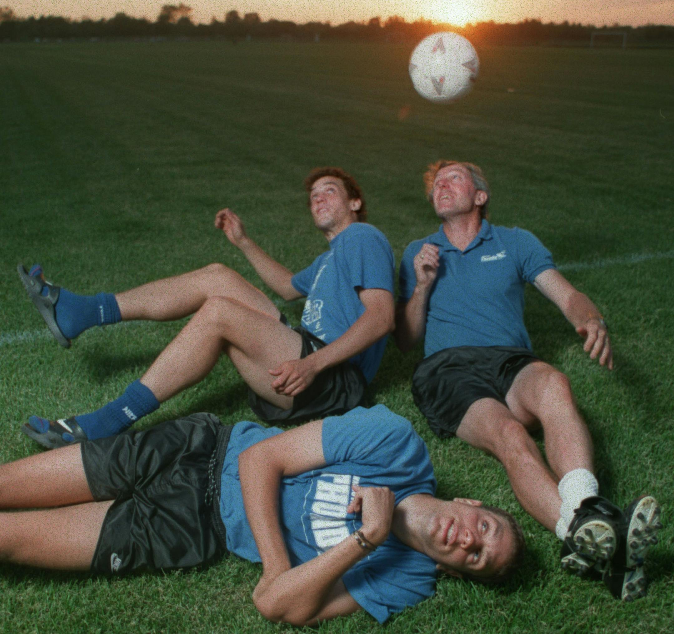 Minnesota Thunder coach Buzz Lagos, right, and his sons Gerard, back, and Manuel, front, after a practice at the National Sports Center in Blaine.