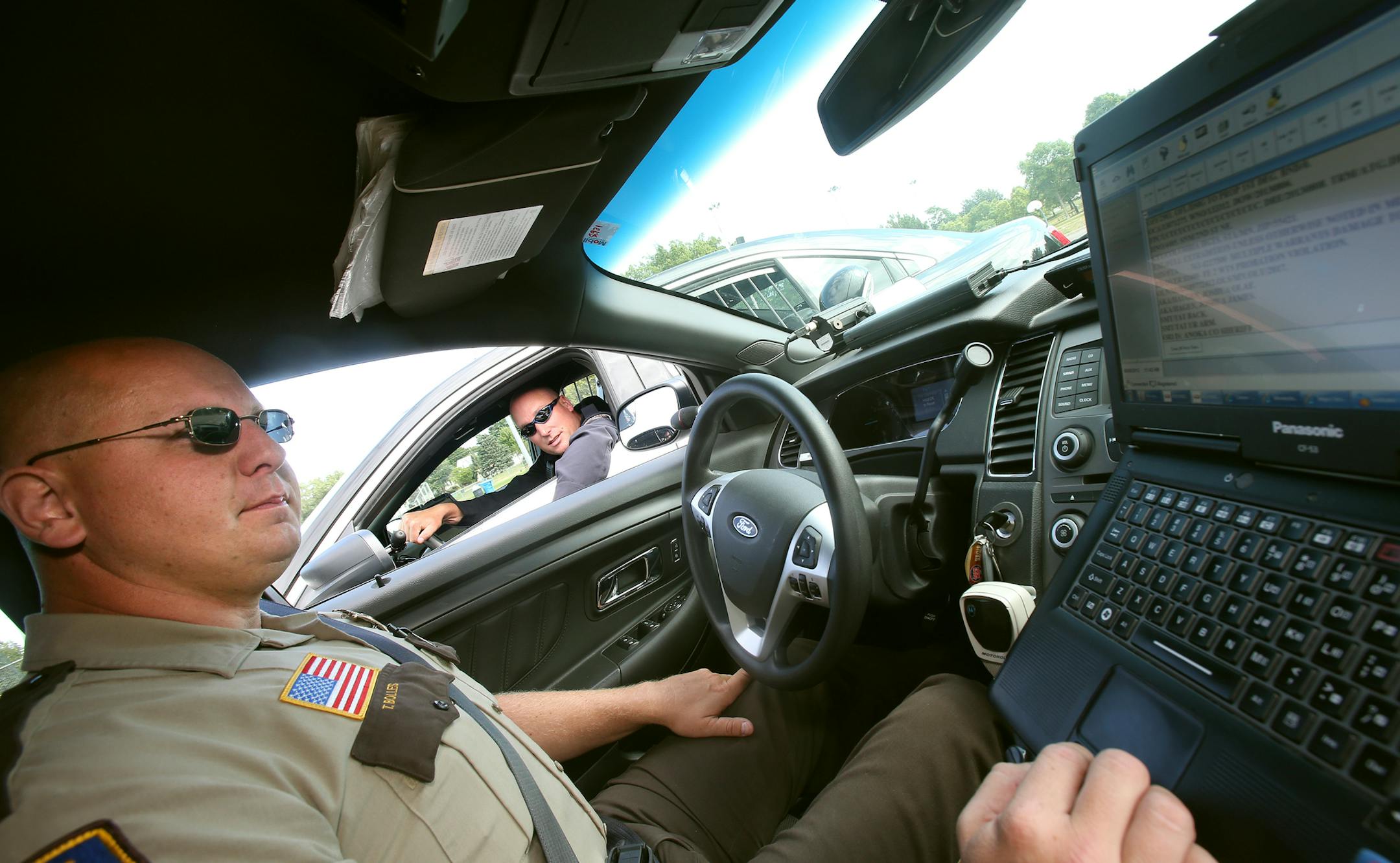 Columbia Heights Officer Jason Beckett (right, black uniform), and Anoka County Sheriff's Deputy Travis Bolles (left in car) work as a team as they are looking for a man who has several warrants for dealing drugs in Columbia Heights. Anoka County Sheriff's Deputy's provides backup for the Columbia Heights Officer on September 05, 2013 in Columbia Heights, MN. ] JOELKOYAMA‚Ä¢joel koyama@startribune The city of Columbus spends $247,000 a year for part-time police coverage. The cit