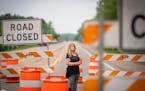Tina Langhans, who lost her daughter in a head on crash on Highway 12 in 2015, posed for a portrait in front of the road construction signs at the cor