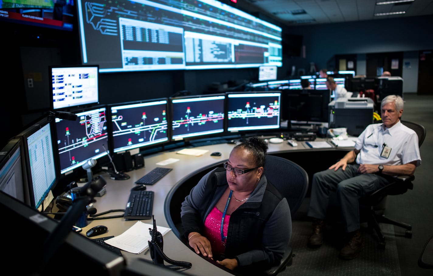 Catrina Boucher, assistant manager of rail operations with Metro Transit, and Clif Brochman, with the vehicle maintenance department, oversaw rail operations Friday night as they waited for a rush of light rail riders to be let out of the Luke Bryan concert at US Bank Stadium. ] (AARON LAVINSKY/STAR TRIBUNE) aaron.lavinsky@startribune.com When events at US Bank Stadium and other large venues end, Metro Transit has the daunting task of shuttling thousands fans who use light-rail trains home. The