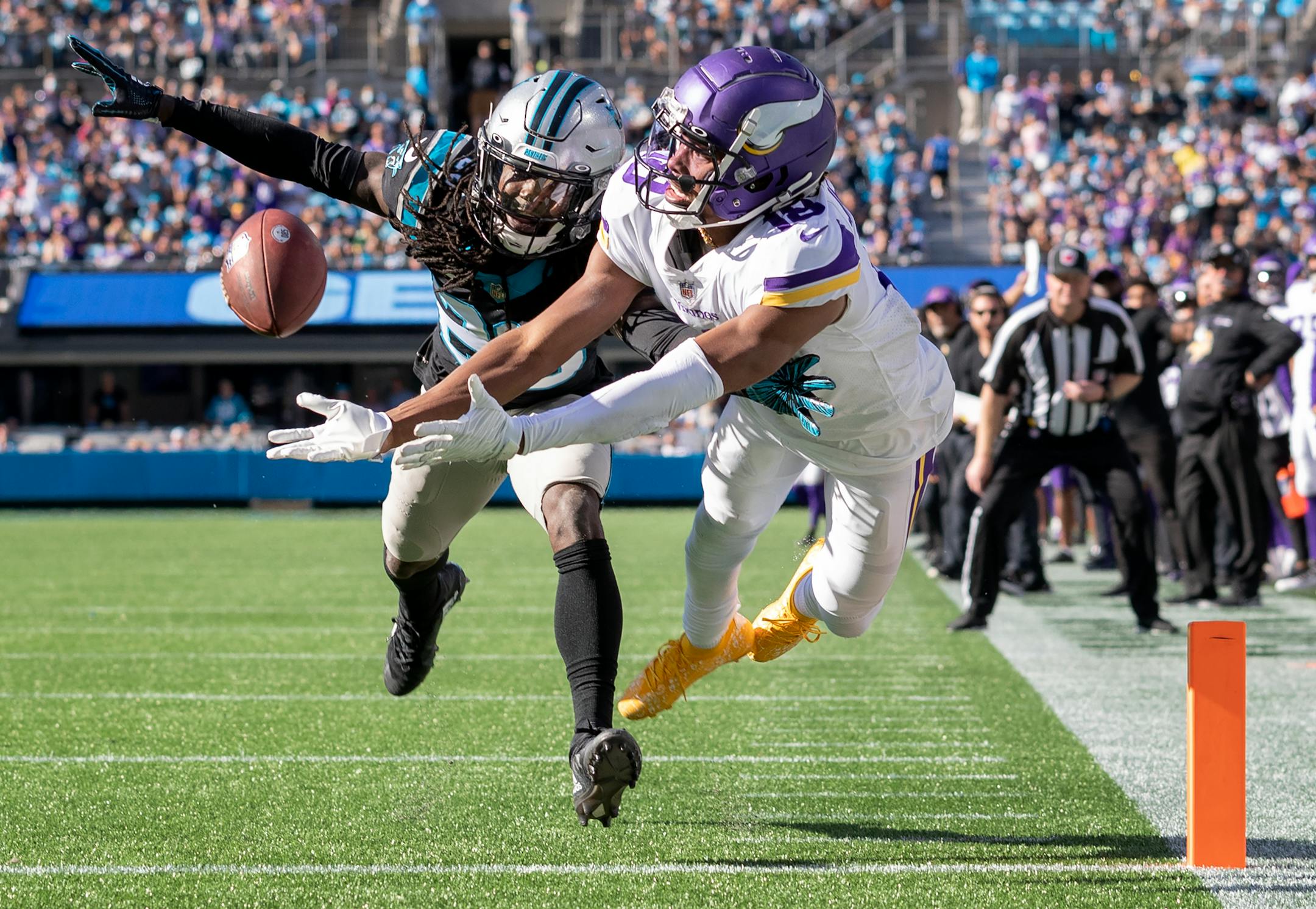 Minnesota Vikings receiver Justin Jefferson (18) could not hang on to a pass while defended by Keith Taylor Jr. (28) of the Carolina Panthers in thee fourth quarter.