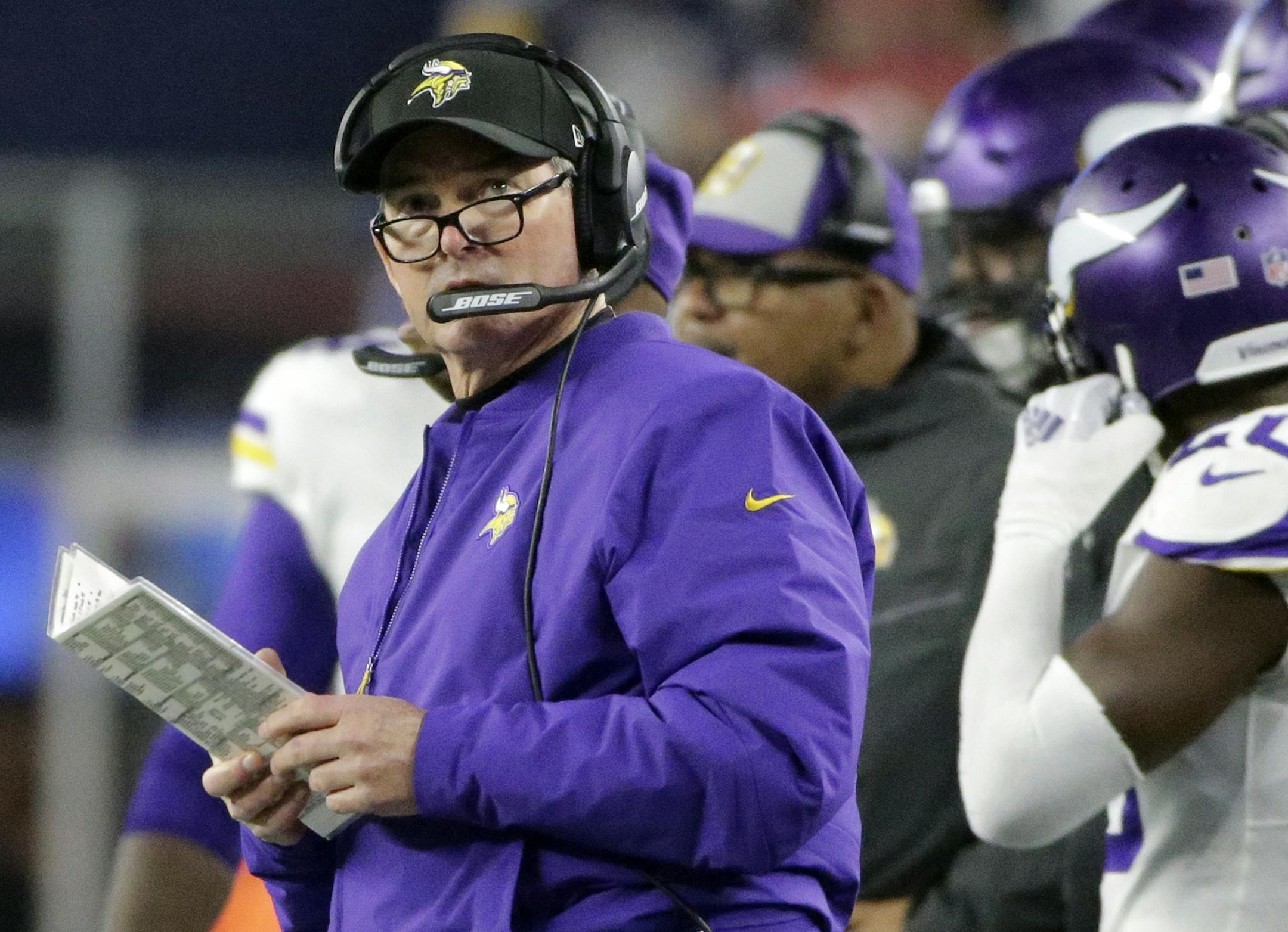 Minnesota Vikings head coach Mike Zimmer watches from the sideline during the first half of an NFL football game against the New England Patriots, Sunday, Dec. 2, 2018, in Foxborough, Mass. (AP Photo/Steven Senne)