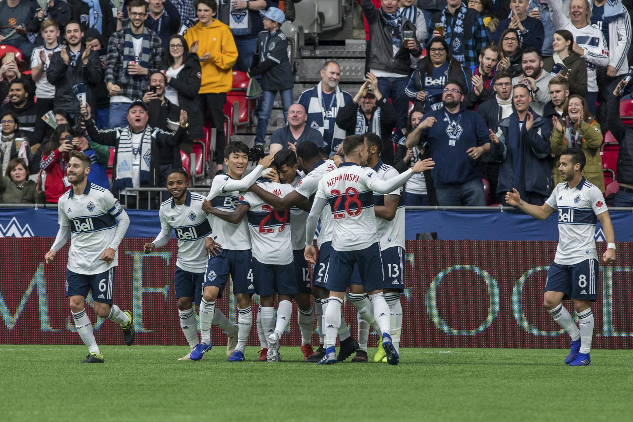 Vancouver Whitecaps celebrate after a goal by Erik Godoy during the first half of an MLS soccer match against Minnesota United, Saturday, March 2, 2019, in Vancouver, British Columbia.