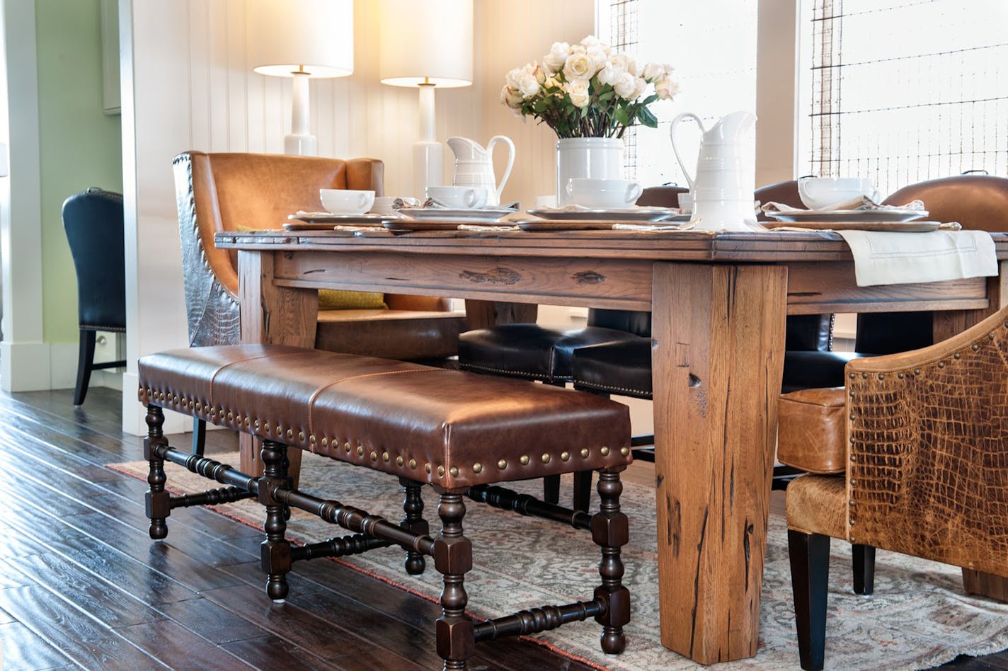 Farm tables can be casual and inviting. This casual dining room from Alder & Tweed has a wood table, leather bench and host chairs. (Doug Burke/TNS) ORG XMIT: 1164578