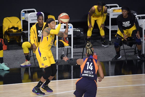 Los Angeles Sparks forward Seimone Augustus shoots a basket during the second half of a WNBA game against the Mercury